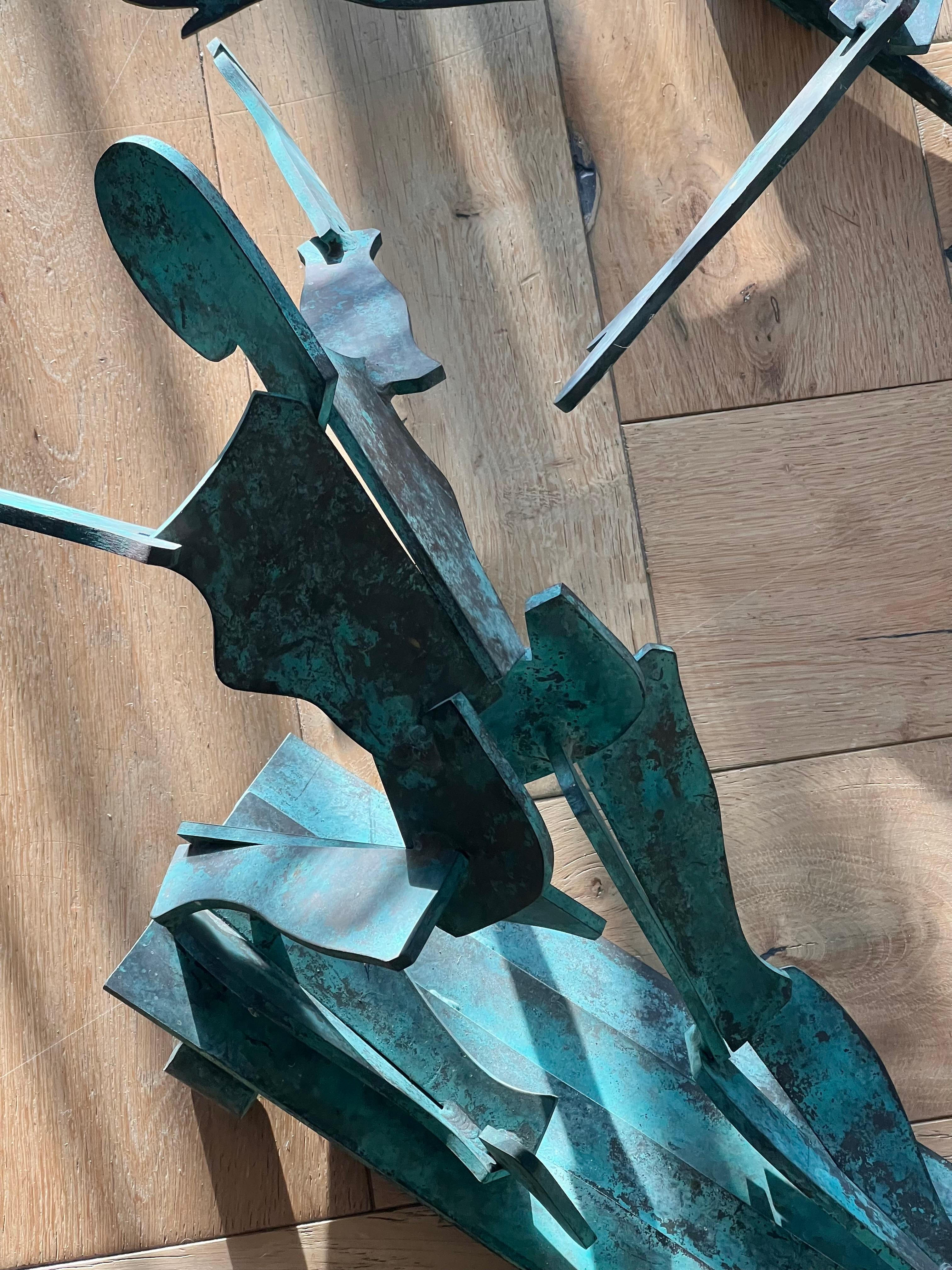 Bronze A pair of large bronze figurative wall hanging sculptures, 20th century For Sale