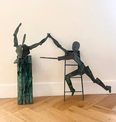 A pair of large bronze figurative wall hanging sculptures, 20th century
