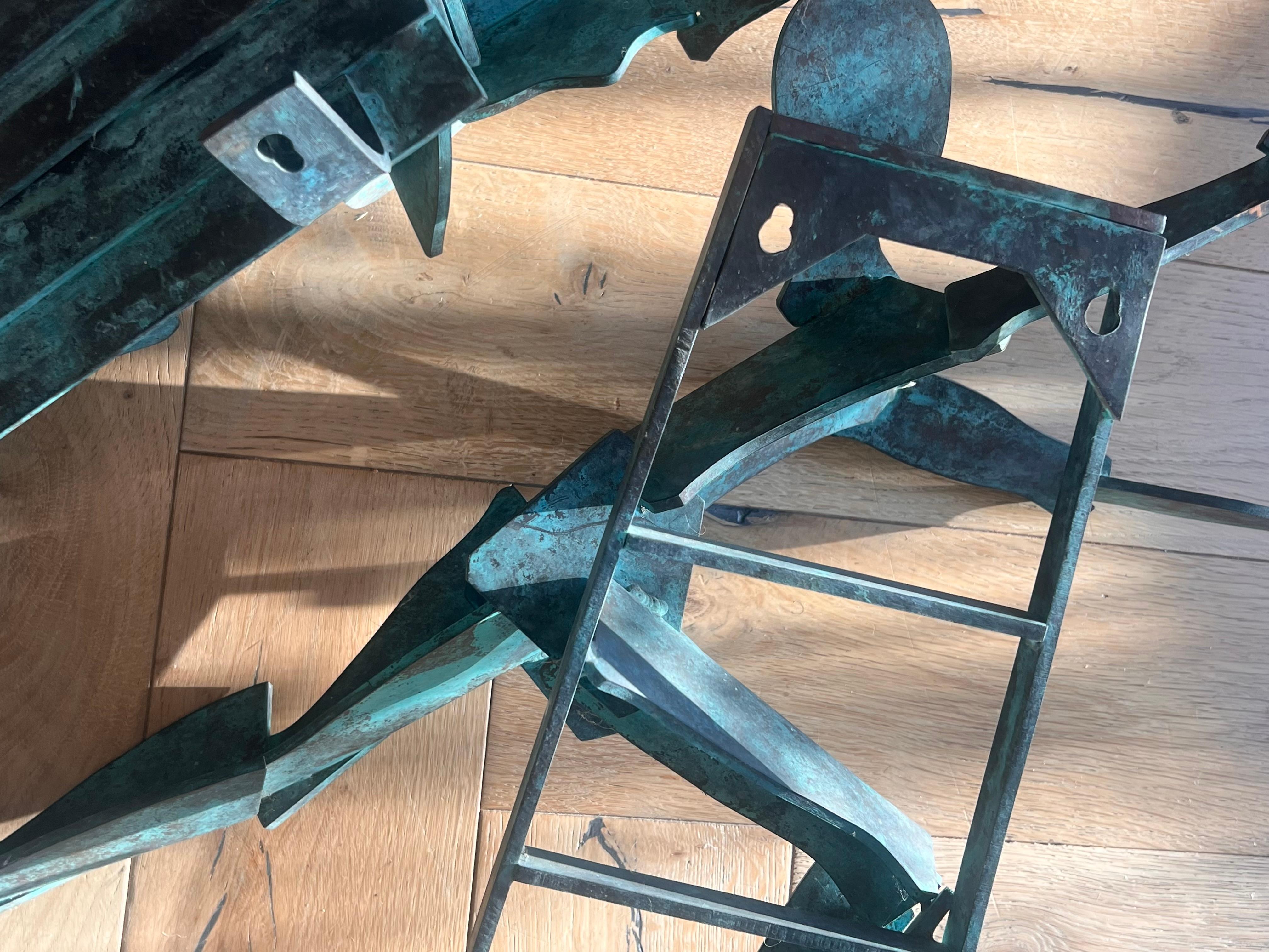Mid-Century Modern A pair of large bronze figurative wall hanging sculptures, 20th century For Sale