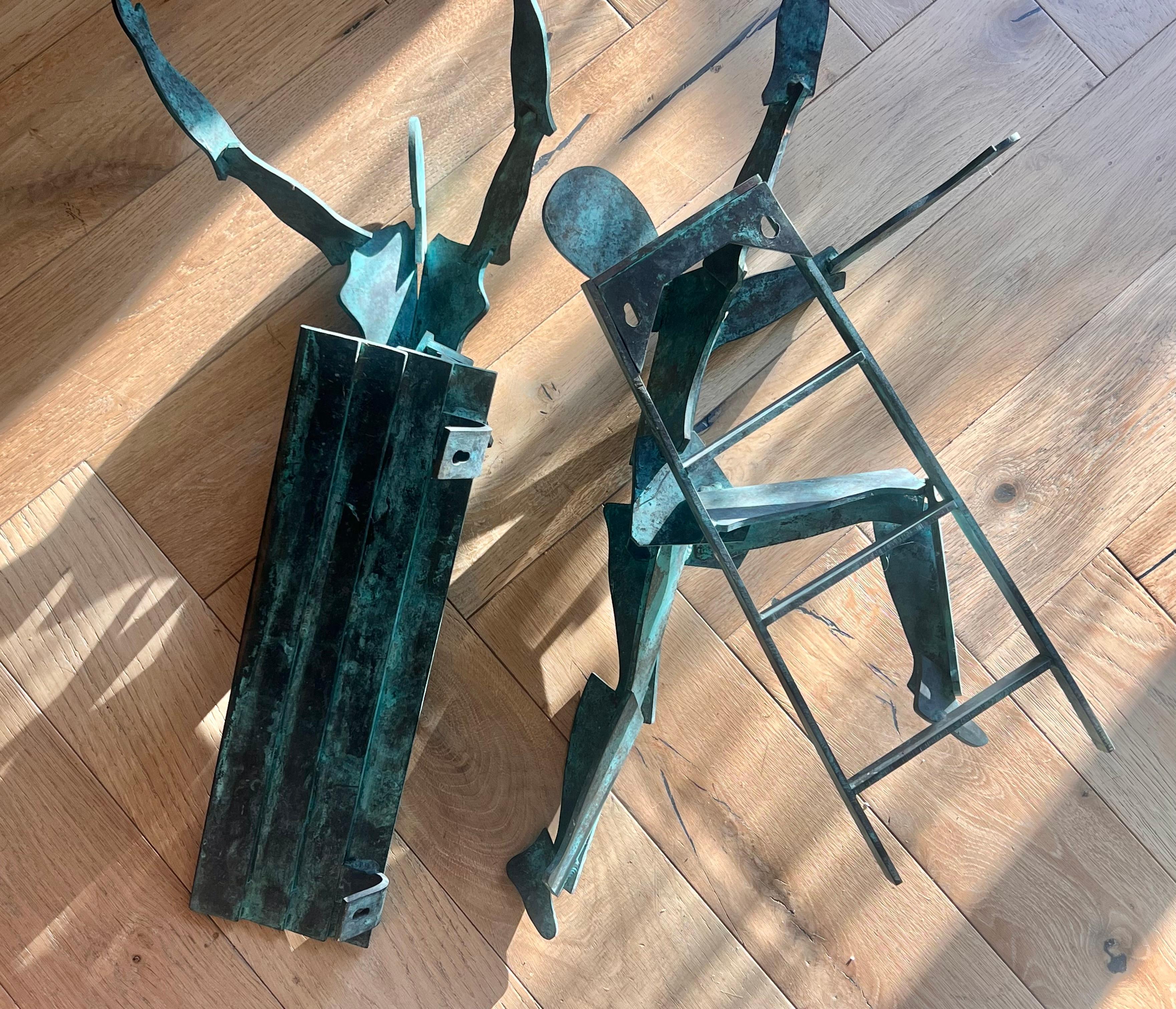 Unknown A pair of large bronze figurative wall hanging sculptures, 20th century For Sale