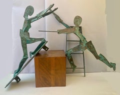 Pareja de grandes esculturas figurativas de bronce para colgar en la pared, S. XX