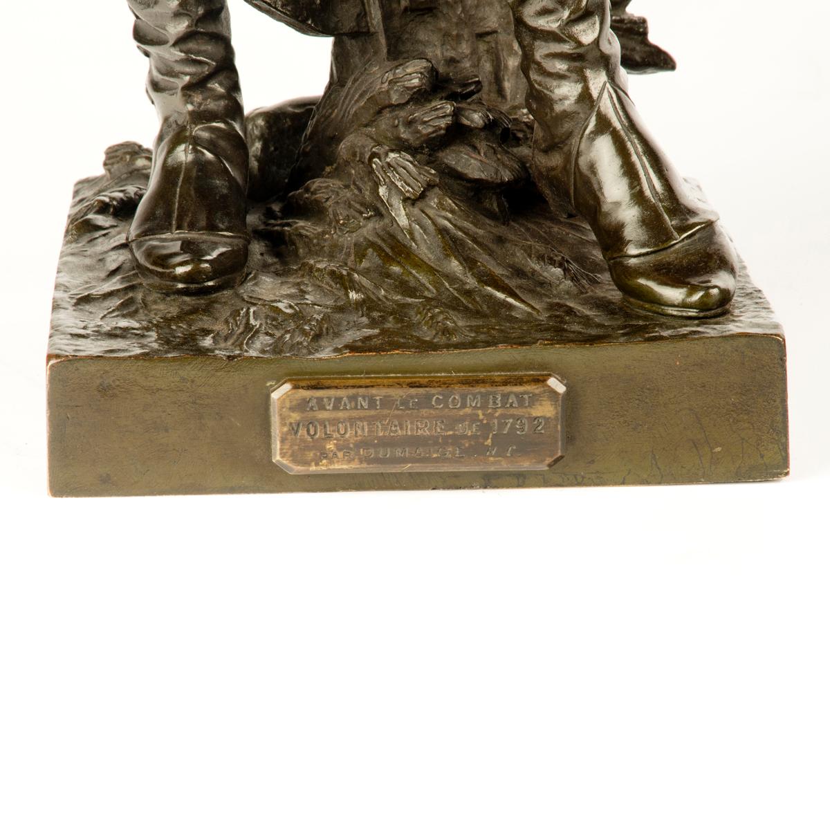 A pair of bronze figures entitled ‘Avant le combat’ and ‘Après le combat’ cast from models by Etienne-Henri Dumaige, each showing a French infantry officer, and the other adjusting the strings of his drum with a plaque stating ‘Après Combat