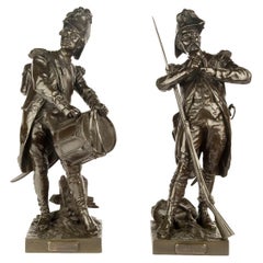 Paire de figurines en bronze intitulées "Avant le combat" et "Après le combat".