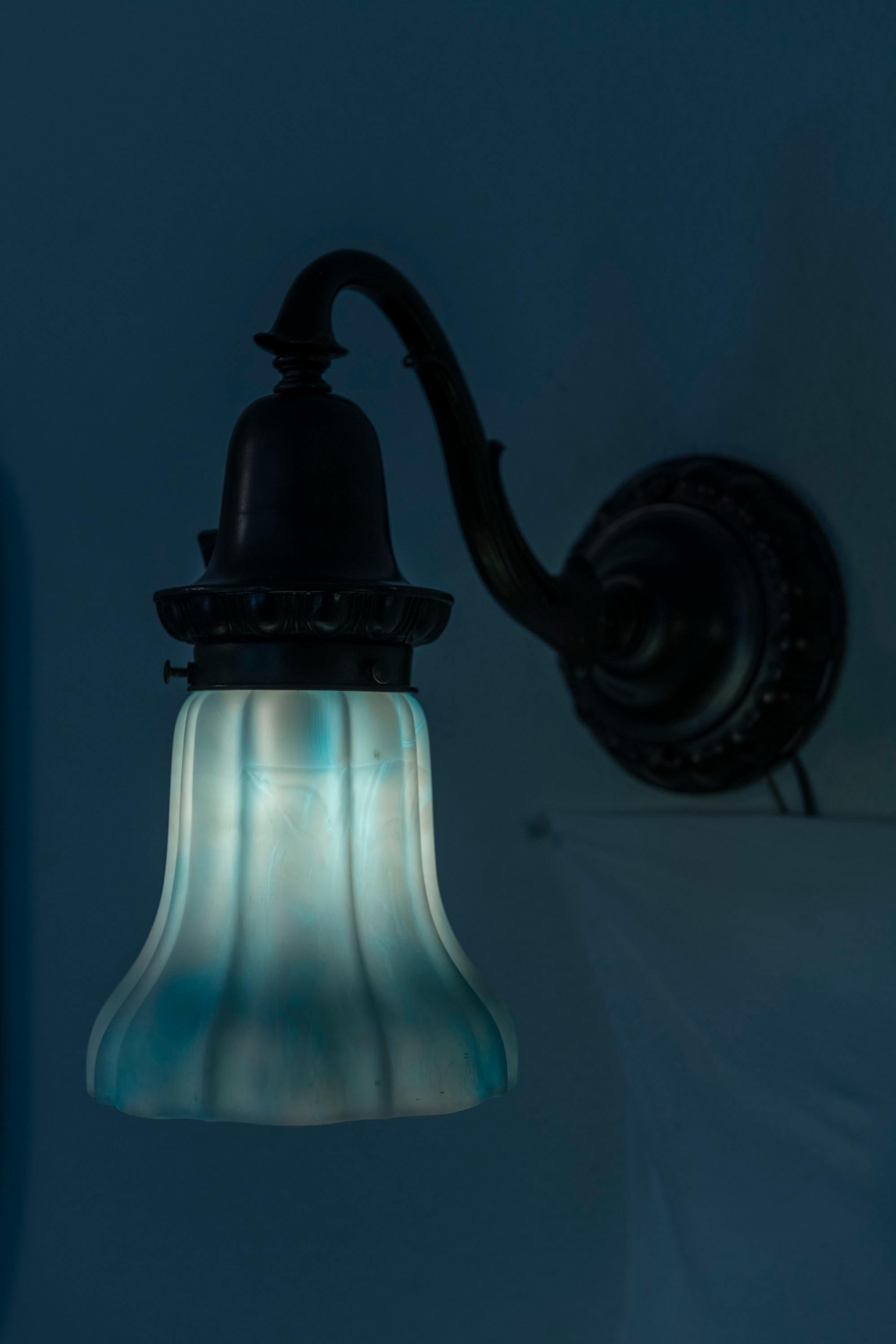 A Pair of Bronze Sconces with Blue/White Kokomo Co. Glass Shades ca. 1910 In Excellent Condition For Sale In Petaluma, CA
