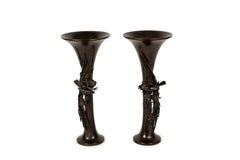 A pair of bronze vase decorated with sparrows in a blossoming cherry branch