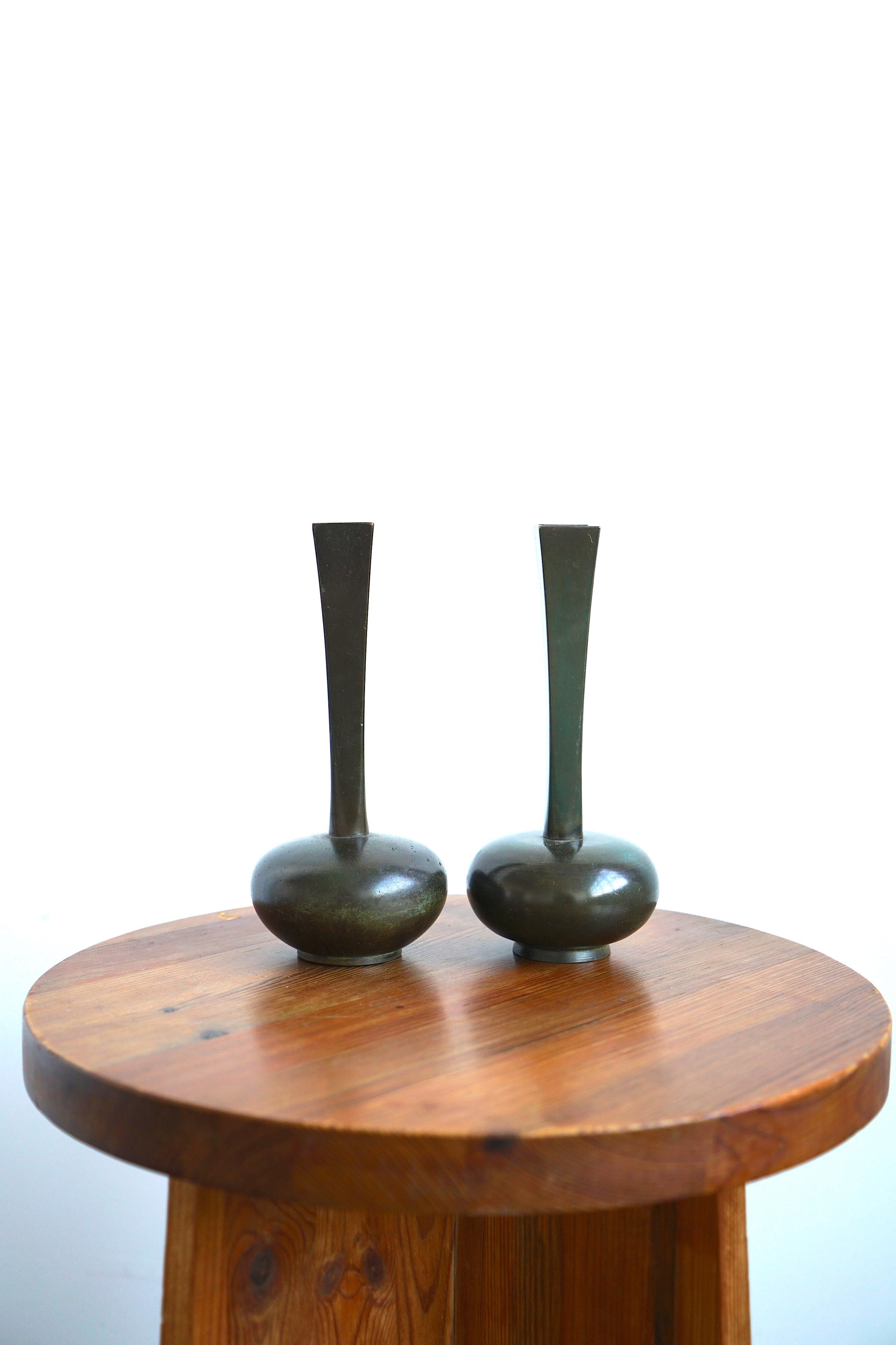 A pair of patinated bronze vases designed by Jakob Angman for GAB, Sweden, Circa 1930th.  Natural patina, marked by manufacturer.