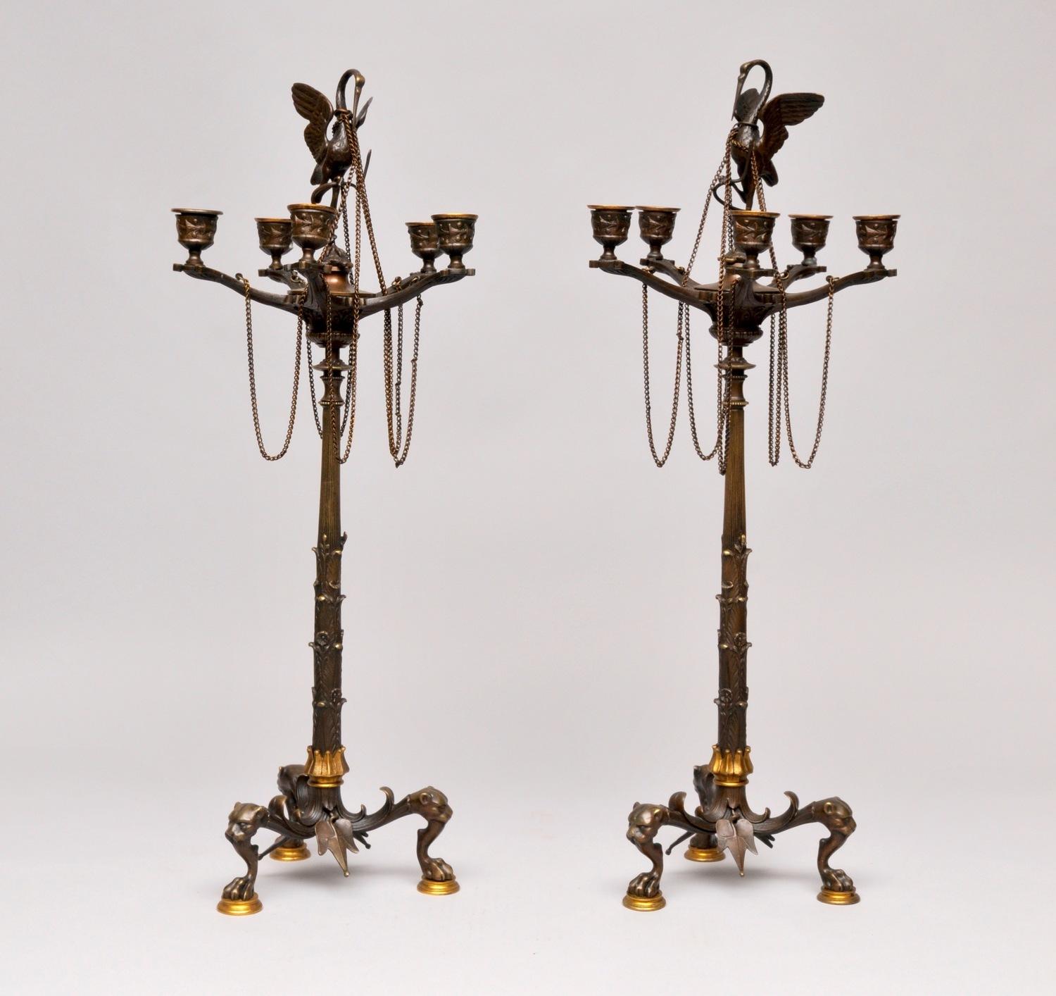 A pair of bronze Victorian candlesticks circa 1840-1860

Empire style. Measure: H 63cm

A beautiful pair of candelabra in the Empire style, of the Victorian era. With five candle holders, an elegant swan rising above and gilt detail on the feet