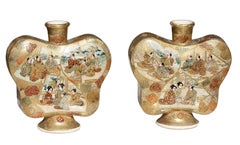 A pair of "butterfly" Satsuma earthenware vases, Meiji period
