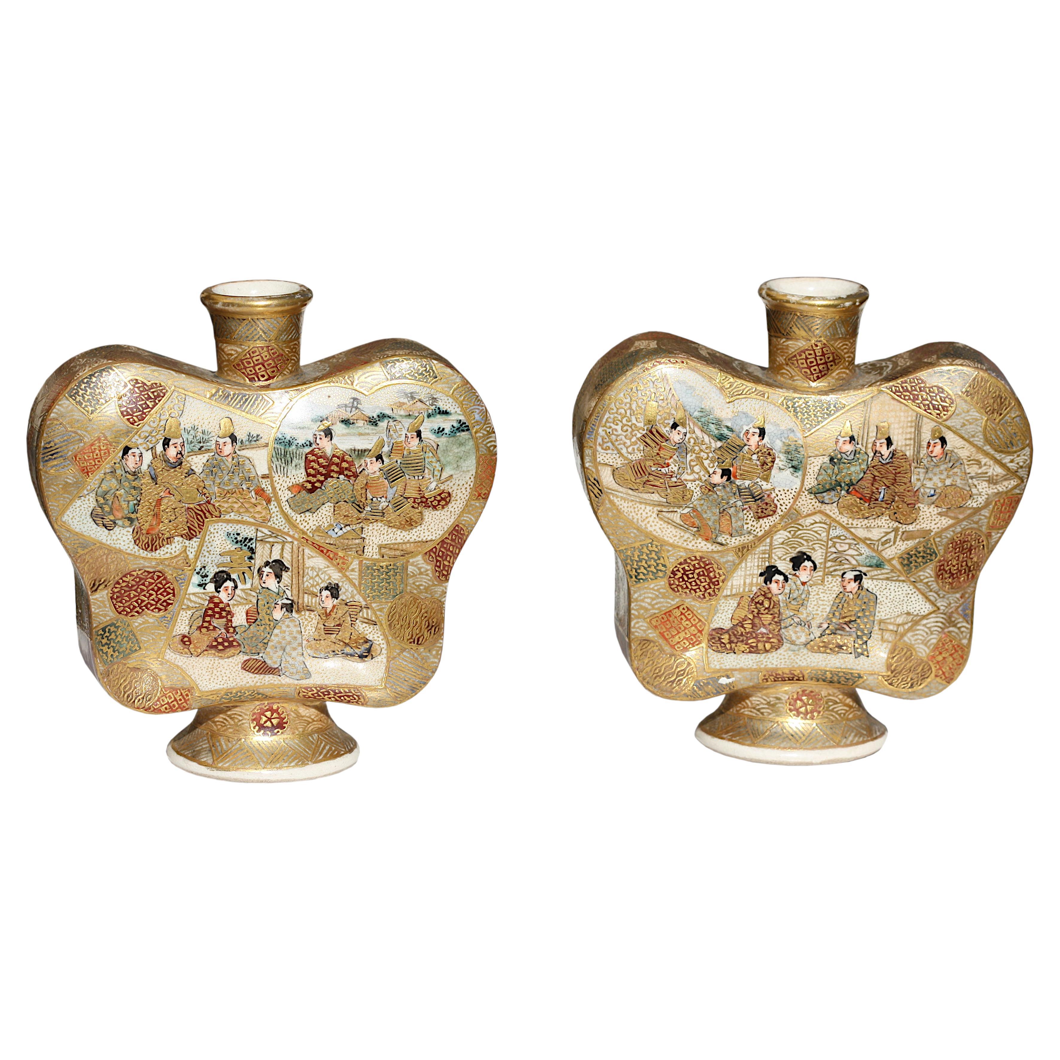 A pair of "butterfly" Satsuma earthenware vases, Meiji period