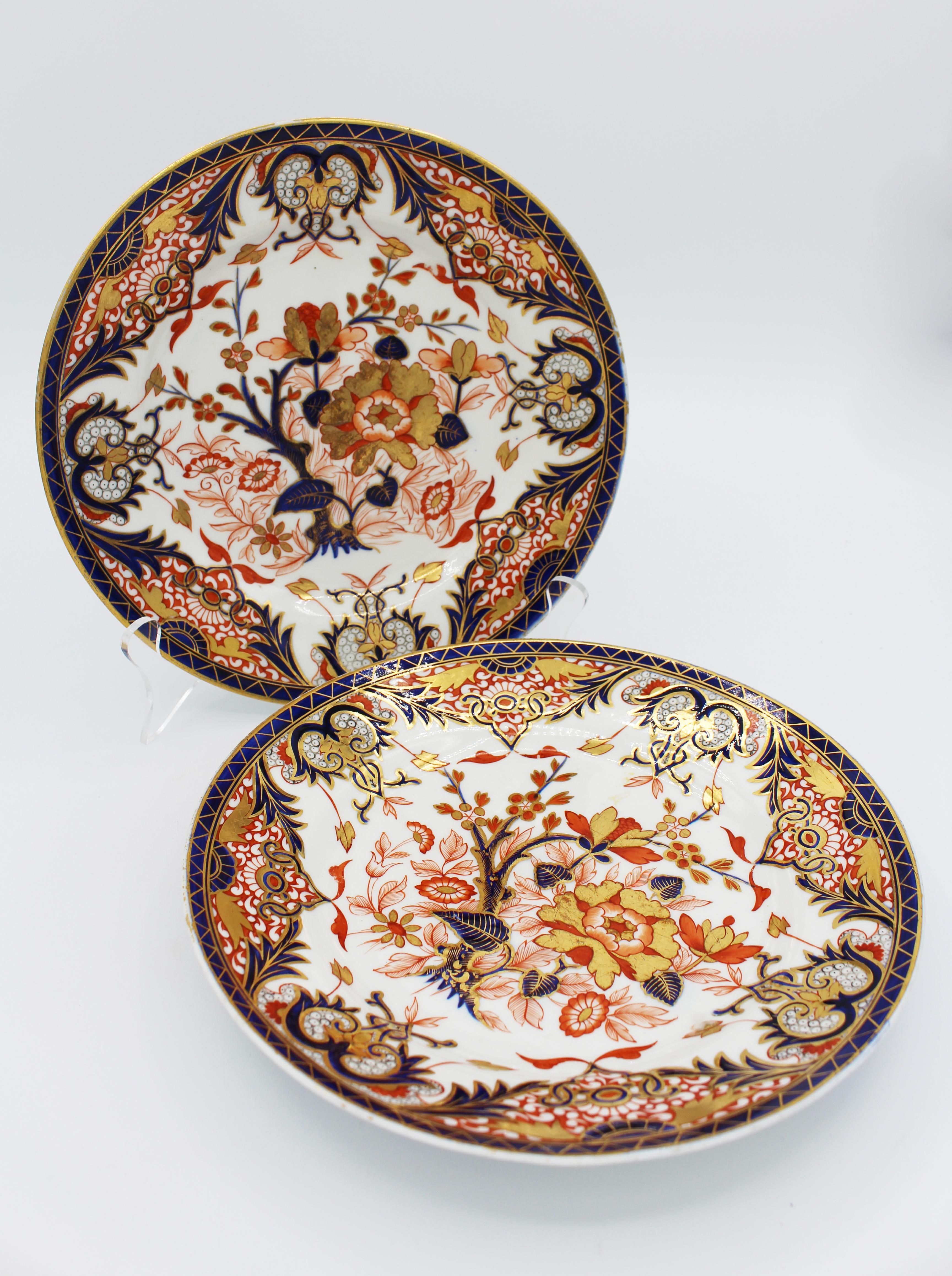 A fine pair of crown derby plates, c. 1820, red mark, in the highly gilded Imari pattern. Excellent condition with under rim decoration mimicking true Japanese Imari. 8 3/4