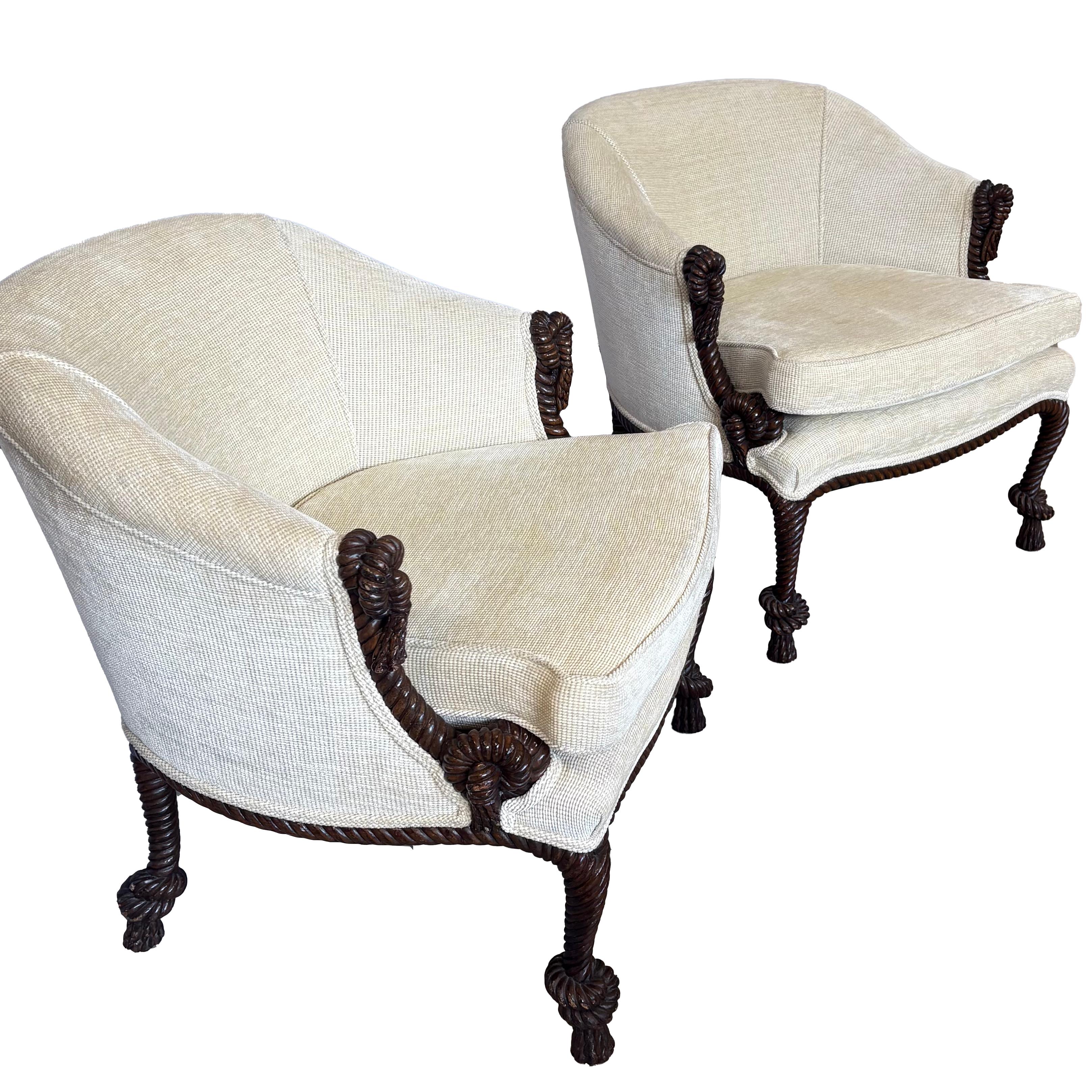 A smart looking pair of c.1950s hand-carved rope and tassel lounge chairs in a warm old surface. They are quite useable now, while they await your impeccable taste in upholstery. 