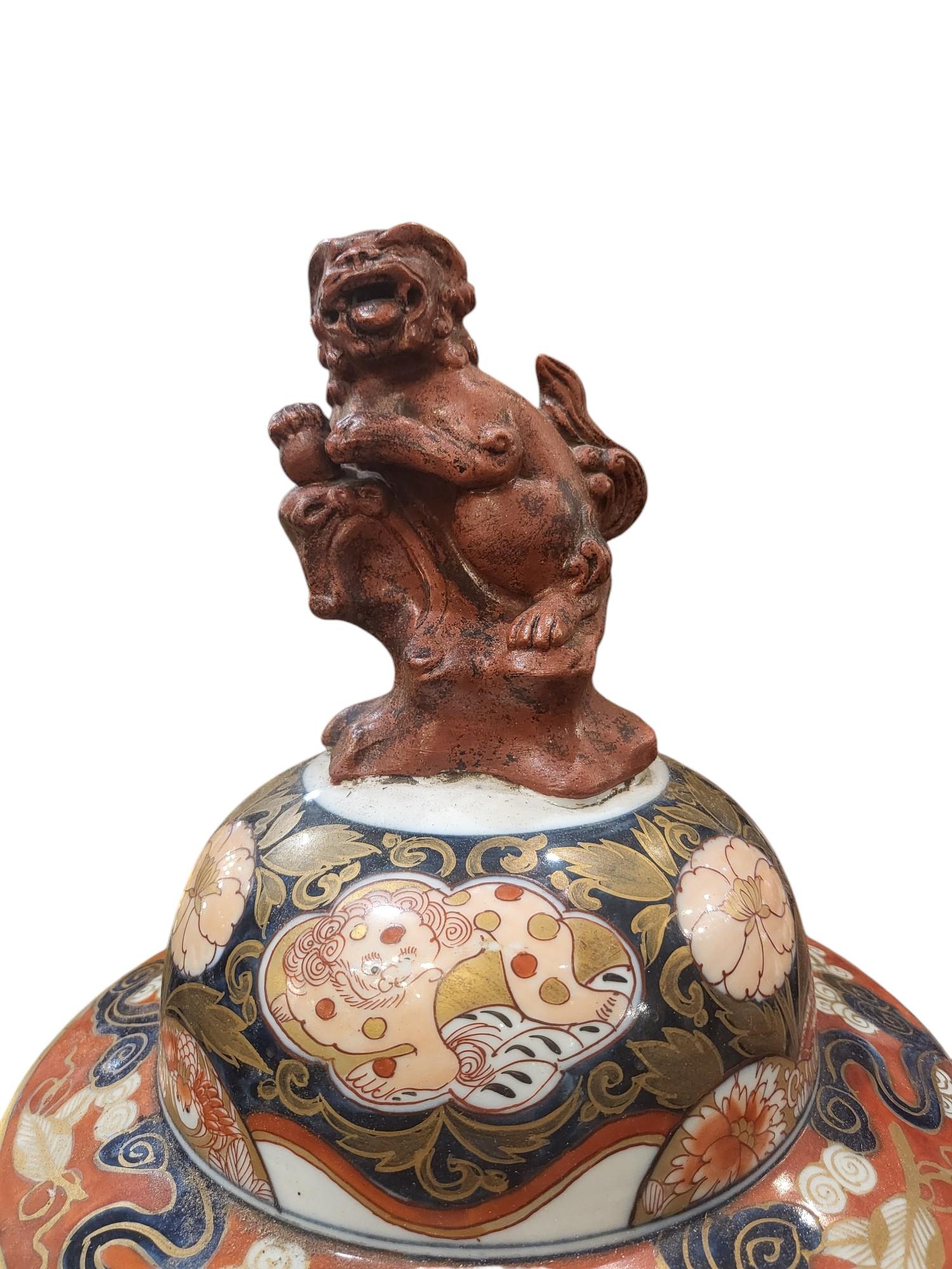 A very fine and Decorative Pair of  Japanese imari  Lidded vases with foo Dog Finials
Lovely Bold Colouring with Oriental Motif Decoration
In wonderful Condition and a Lovely Addition to any Room 
Date C1880s

