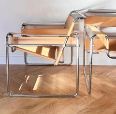 A pair of camel toned leather and chrome Wassily chairs by Marcel Breuer, 20th c