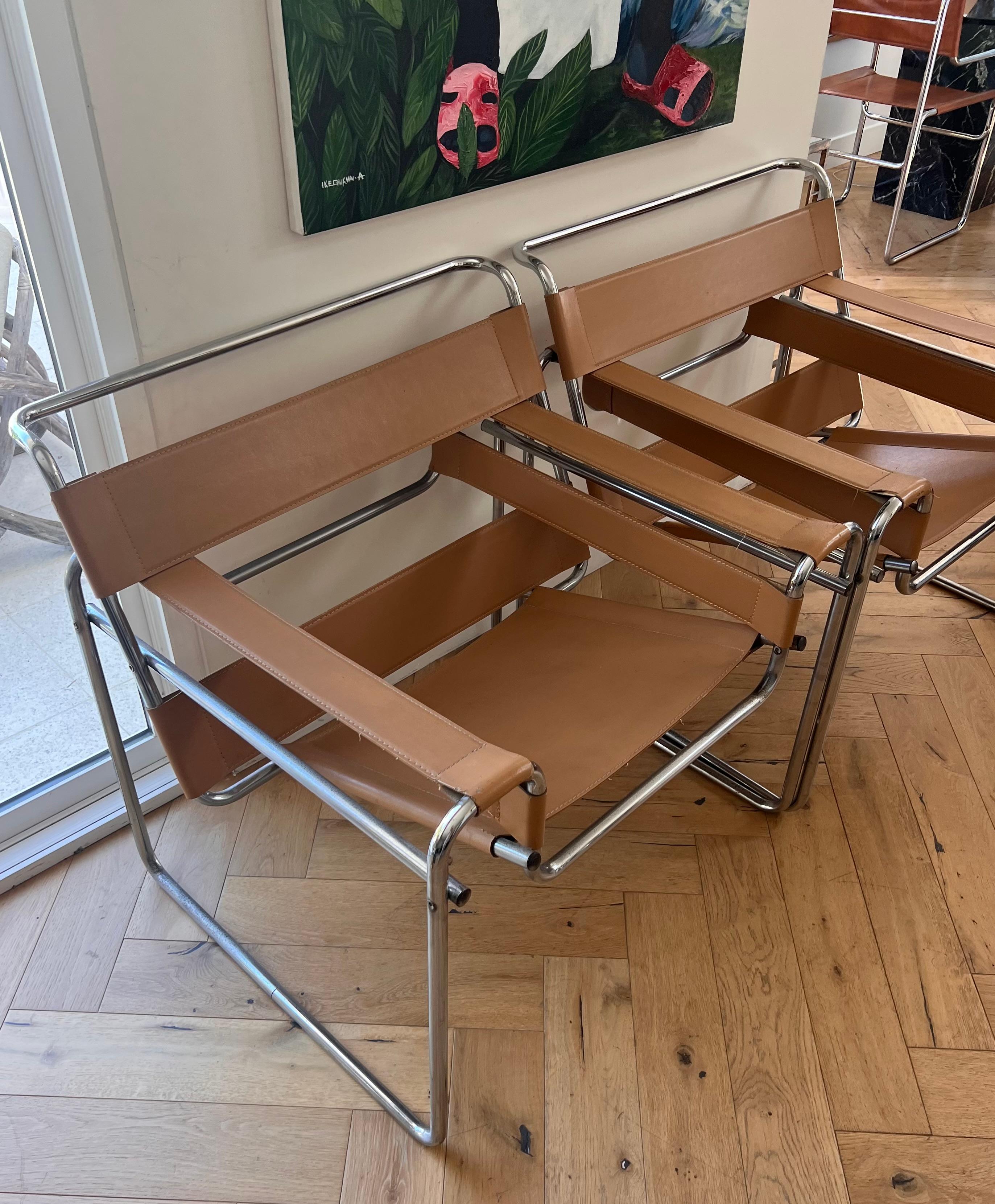 Leather A pair of camel toned leather and chrome Wassily chairs by Marcel Breuer, 20th c