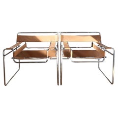 A pair of camel toned leather and chrome Wassily chairs by Marcel Breuer, 20th c