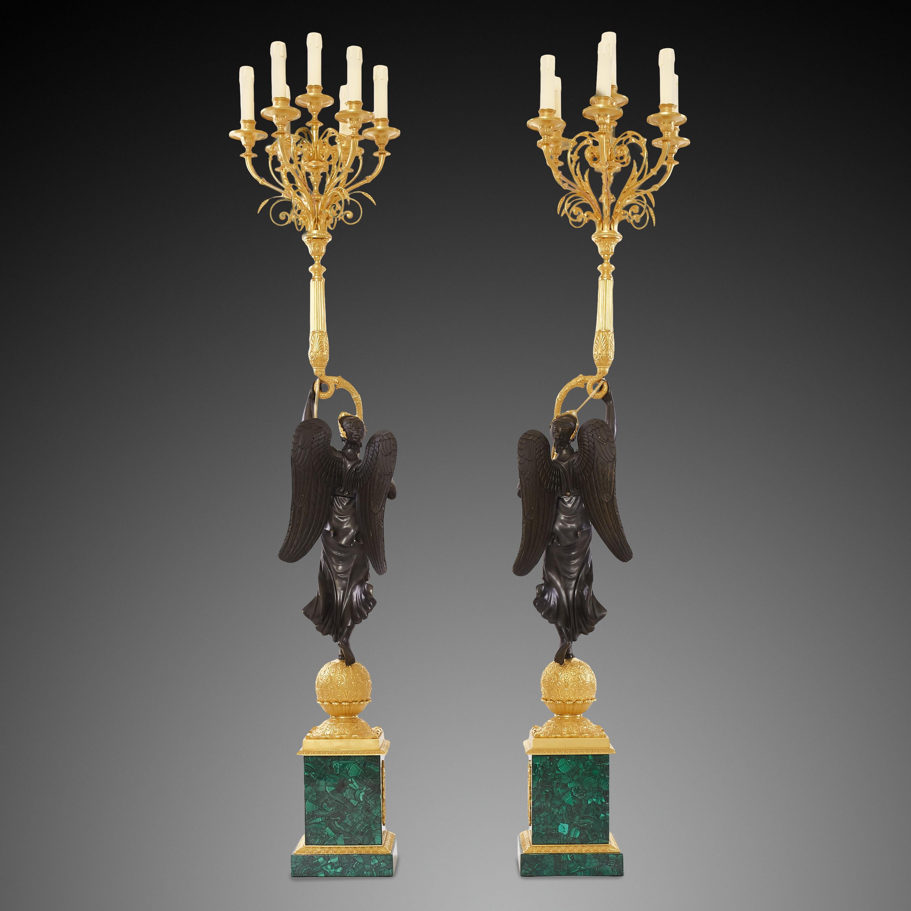 These antique candelabras are a wonderful combination of three contrasting tones: the golden color of gilt , the black color of the bronze that makes the angel figure a focal point and the deep green color of malachite brings high aesthetics