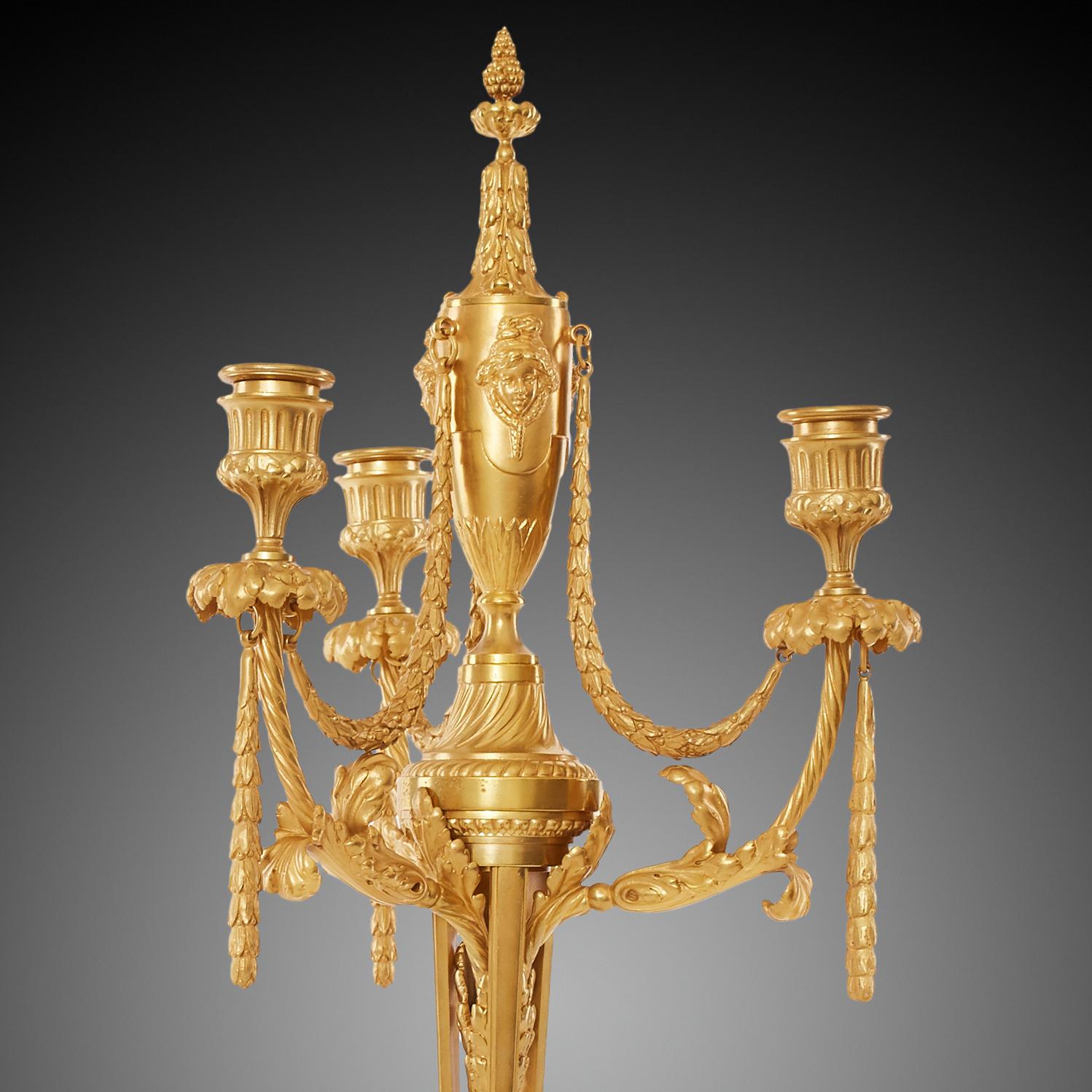 These large and finely cast candelabrum were made by the well respected bronzier Ferdinand Barbedienne. They are truly exceptional examples of 19th century French craftsmanship. They are decorated in the Louis XVI style and each with three-light