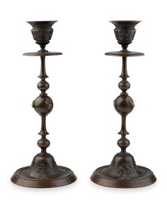 A Pair of Candlestick in Bronze adorned with detailed insects