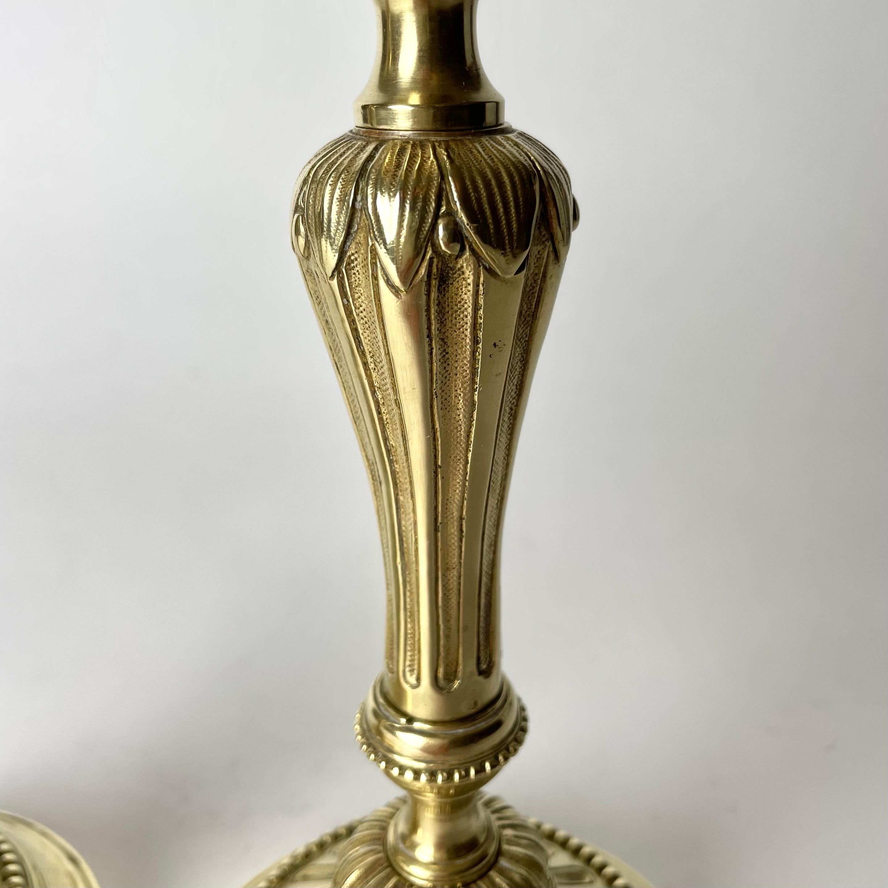 A Pair of Candlesticks in brass, early 20th Century, in the style of Louis XVI For Sale 1