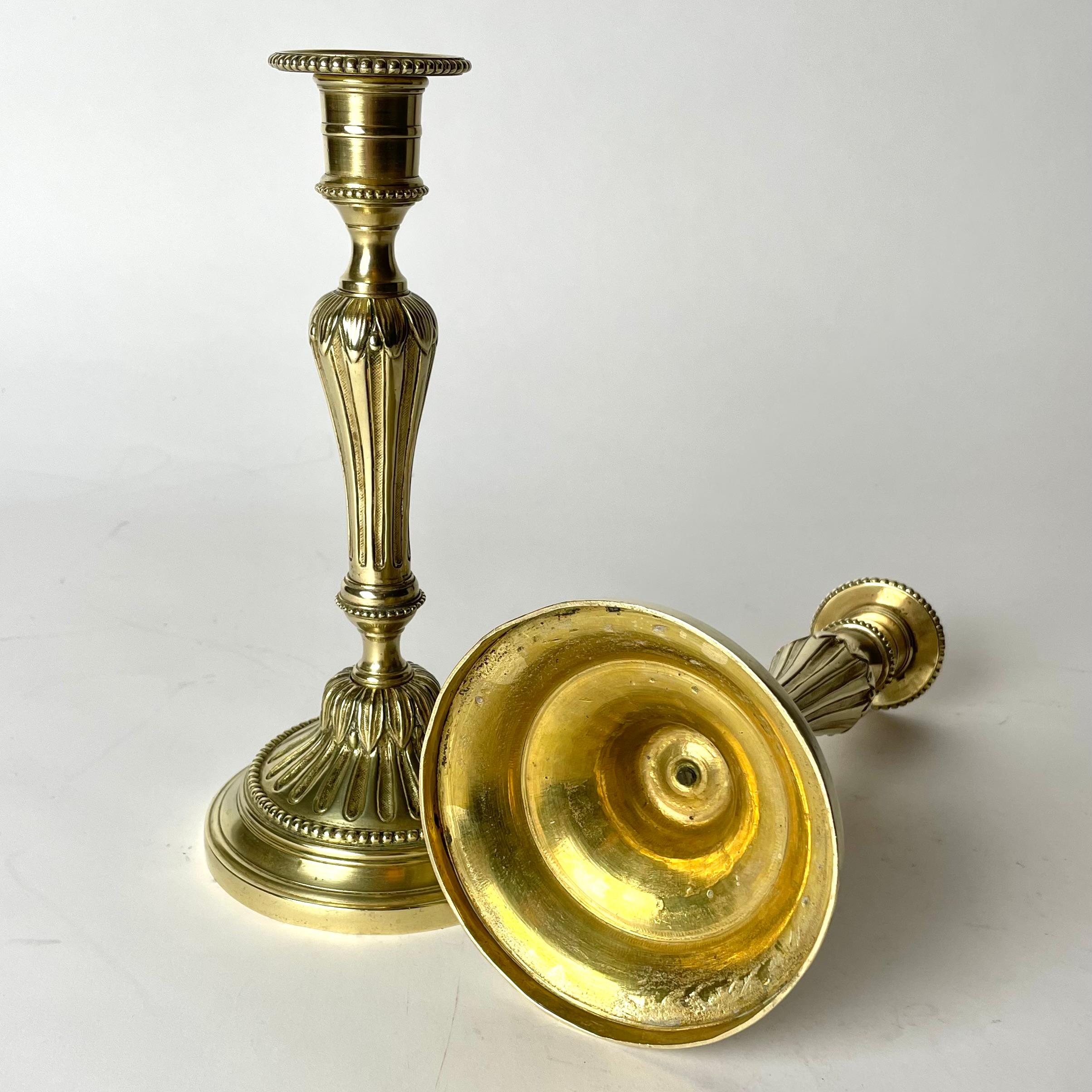 A Pair of Candlesticks in brass, early 20th Century, in the style of Louis XVI For Sale 3