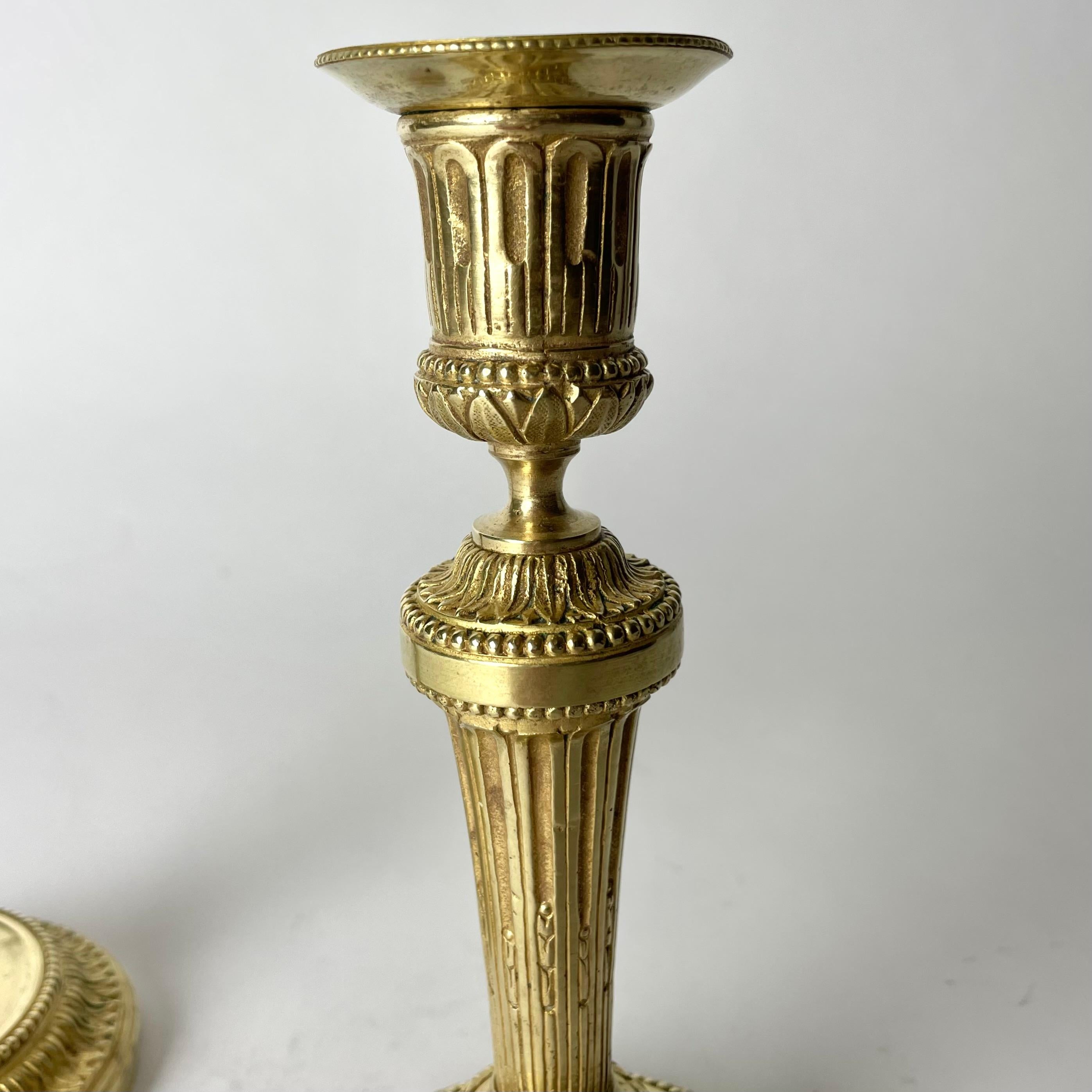 A Pair of Candlesticks in Gilt Bronze, 19th Century, in the style of Directoire For Sale 2
