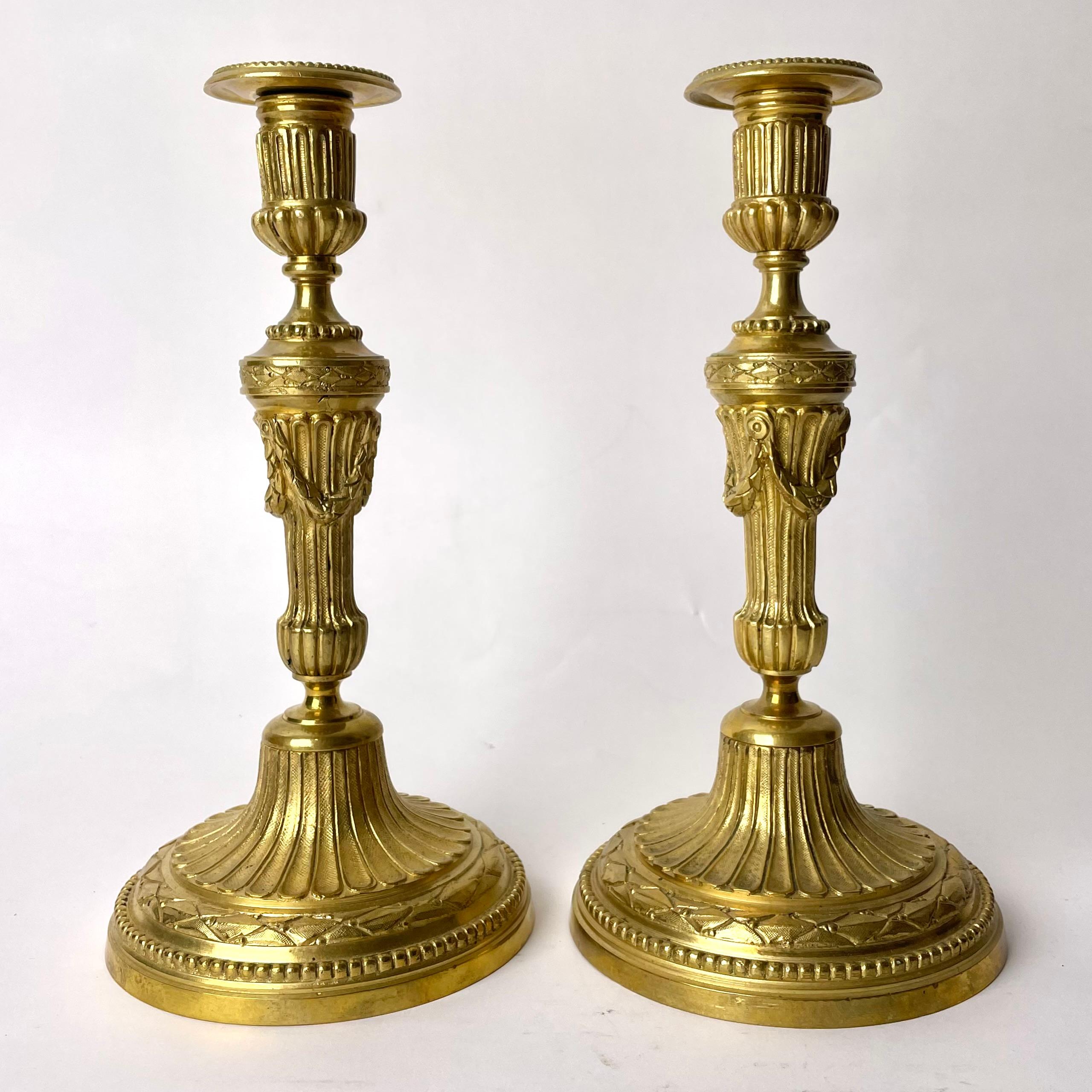 A Pair of Candlesticks in Gilt Bronze, 19th Century, in the style of Louis XVI For Sale 3