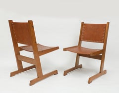 A Pair of Cantilevered Mid-Century Colombian Leather Sling Chairs