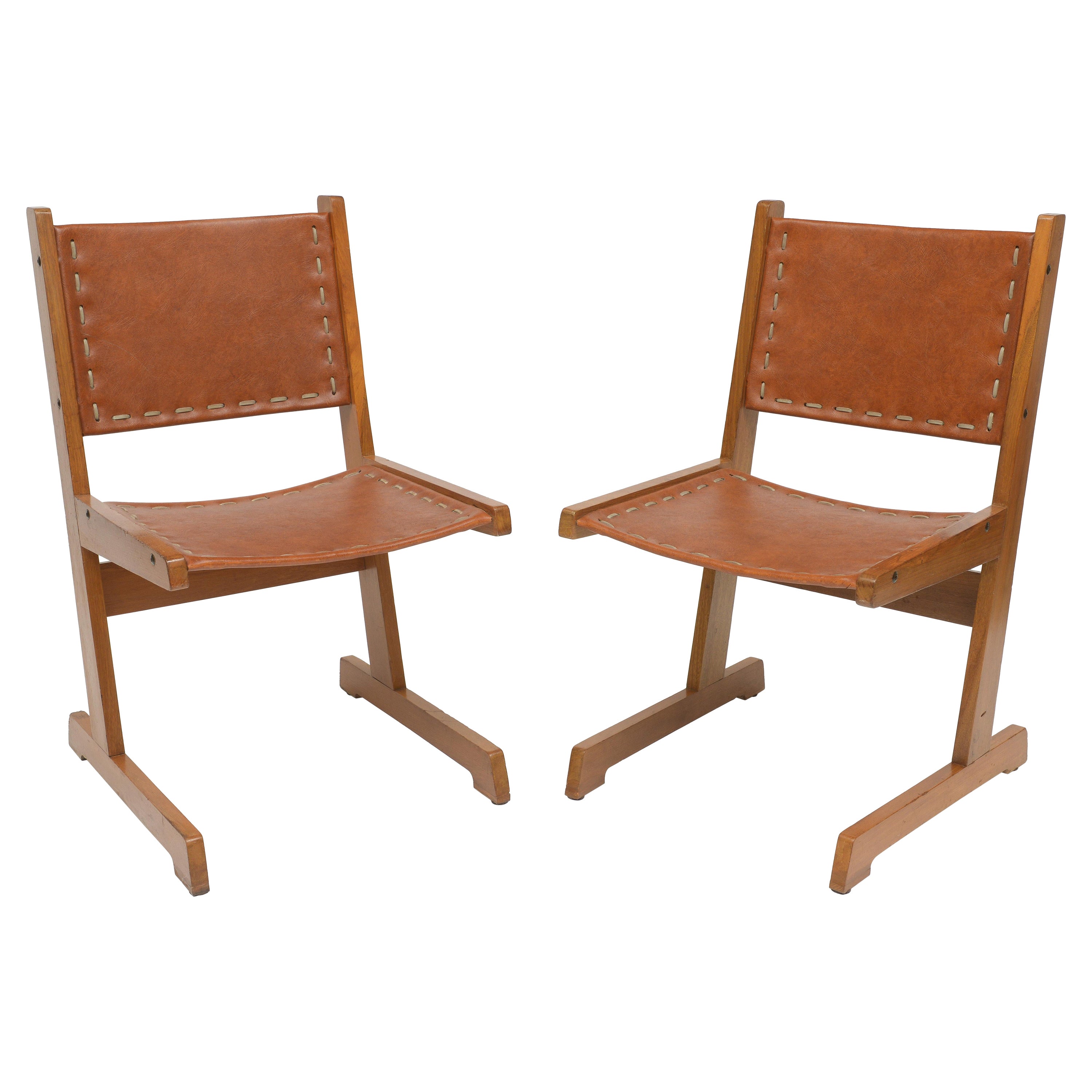 A Pair of Cantilevered Mid-Century Colombian Leather Sling Chairs