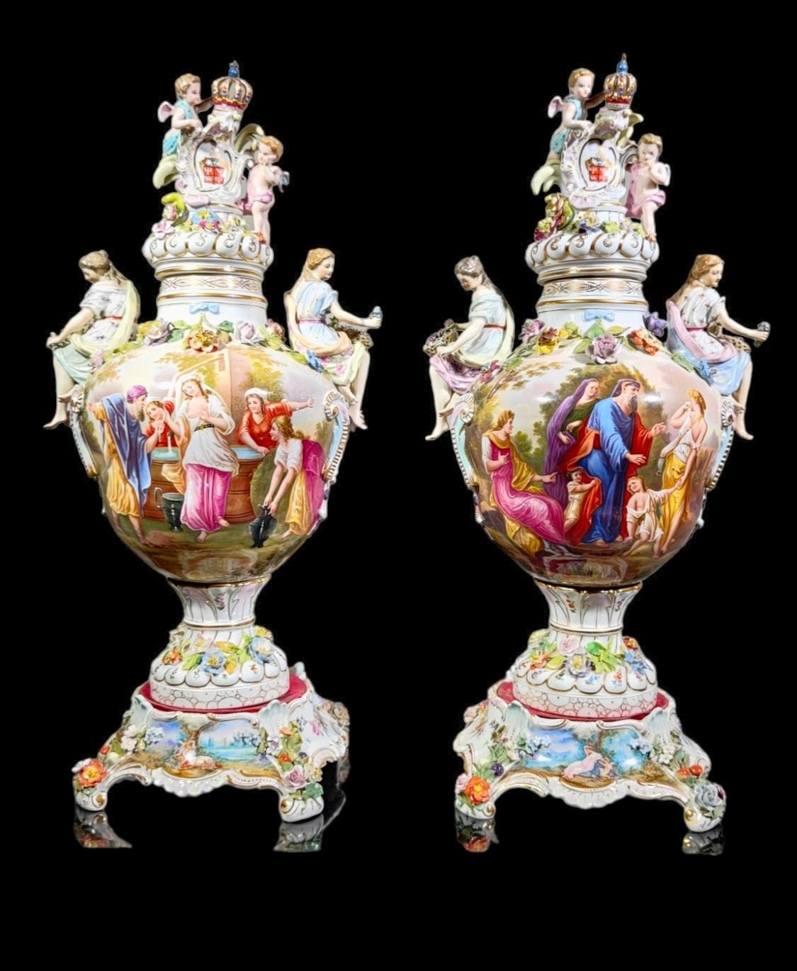 A Pair Of Carl Thieme  German porcelain Vases, Lids And Pedestals (potschappel)
CARL THIEME (GERMAN, 1816-1884) FOR DRESDEN, VASES COVERED IN PAINTED PORCELAIN, THE PAIR. Angels crowning a shield crest and adorning with flowers atop the covers. Each