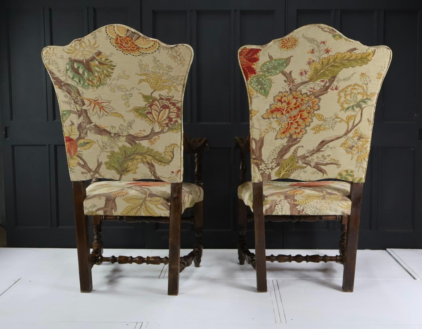 A pair of 19th century Carolean style armchairs.
Incredibly comfortable and in great condition, with solid frames, scrolled arms and turned stretchers.
The armchairs are upholstered in a stunning floral design.
