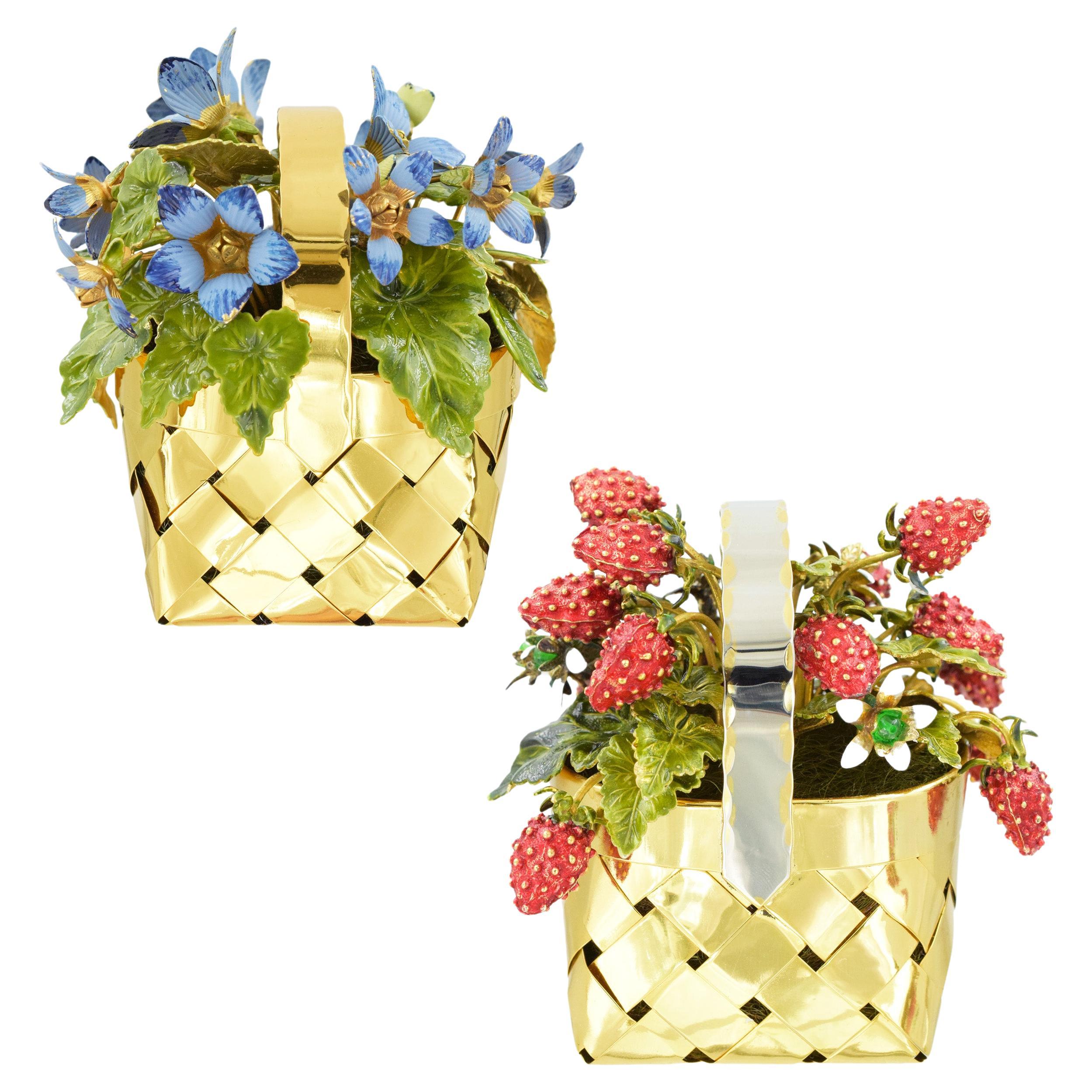 A pair of Cartier enamel and silver flower and fruit baskets. 