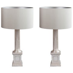 A Pair of Carved and silver gilt Painted Wood Column Table Lamps