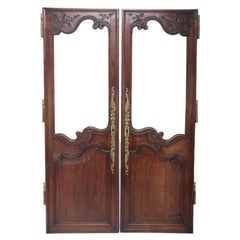 Pair French oak 19th Century cabinet doors with glass panel, and brass hardware