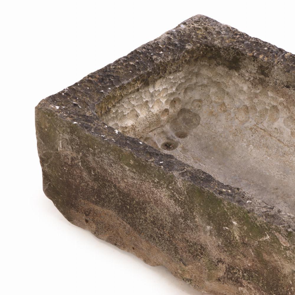 These rectangular planters are crafted of Belgian Blue Stone (also known as Petit Granit or Pierre Bleu). is a high-density limestone, often with fossil inclusions, known for its durability and blue-grey color. It was widely used in architectural