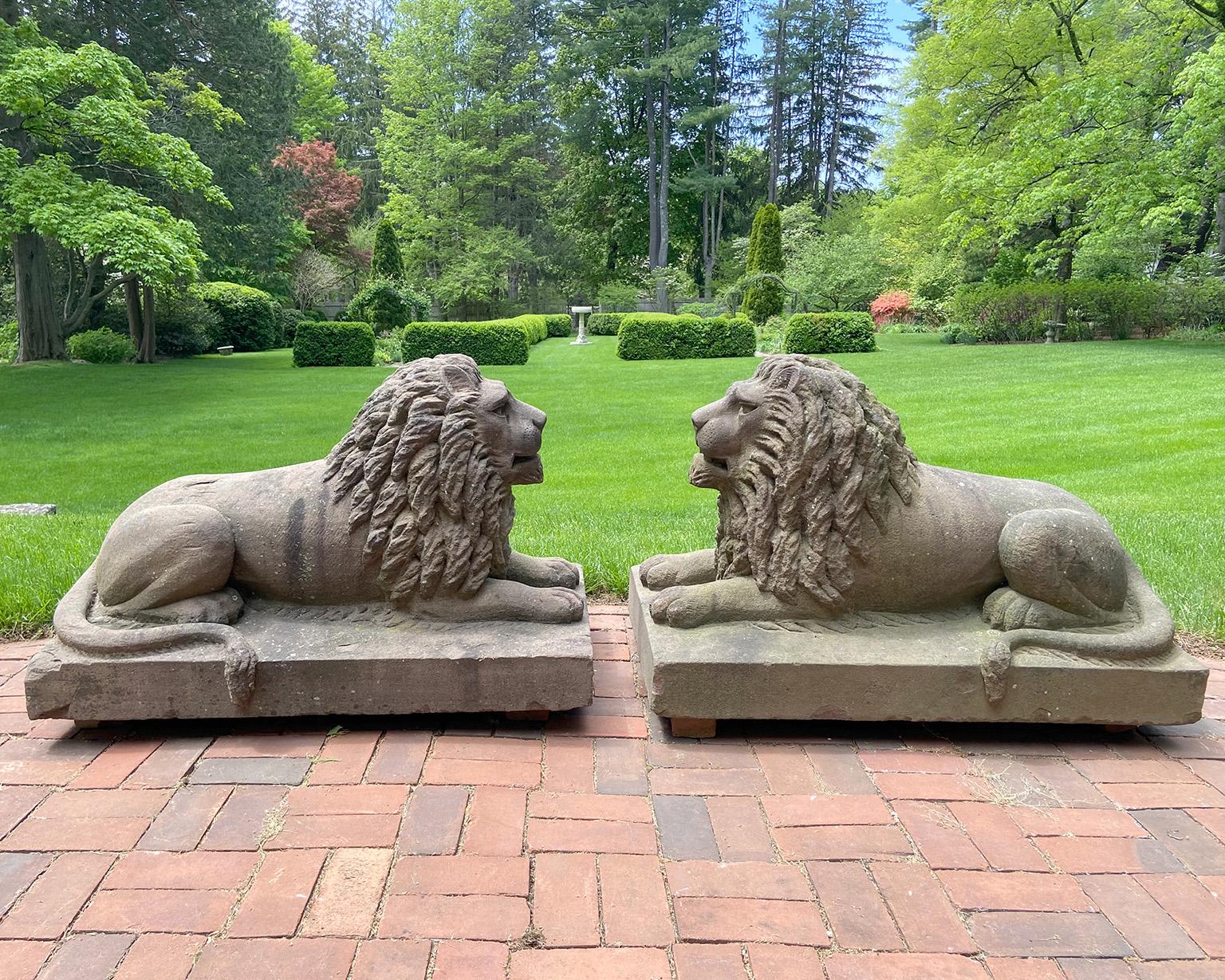 Pair of Carved Brownstone Recumbent Lions in the American Folk Art Style In Good Condition For Sale In Katonah, NY