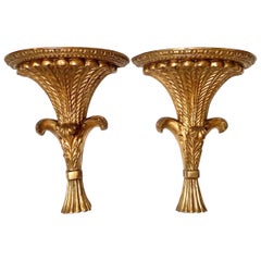 A Pair of Carved Gilt Wood Wall Shelves