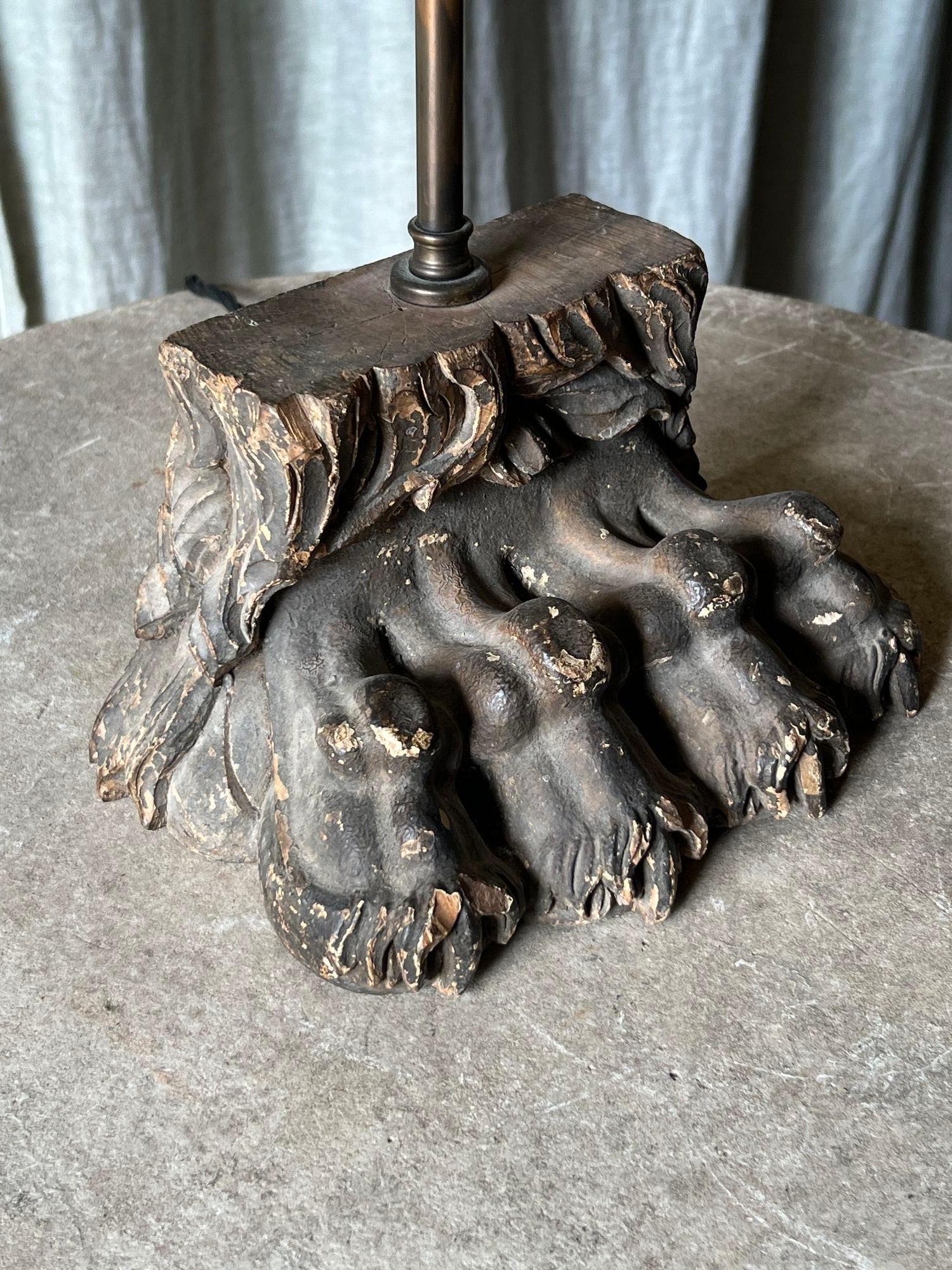 Hardwood A pair of carved lions paw lamp bases