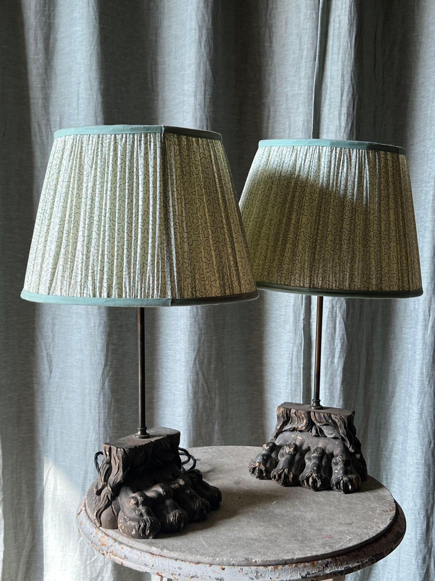 A pair of carved lions paw lamp bases 1