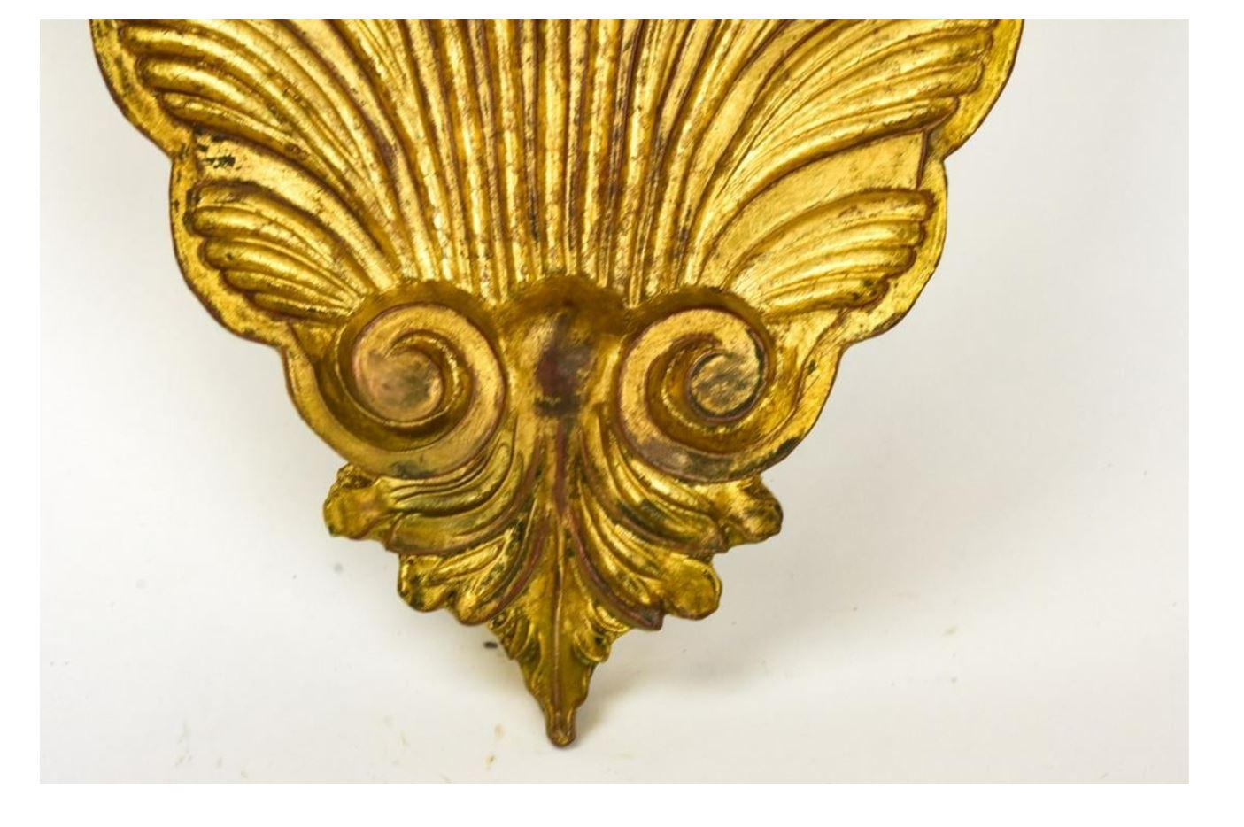 A pair of carved Rococo Rocaille giltwood brackets in shell form.