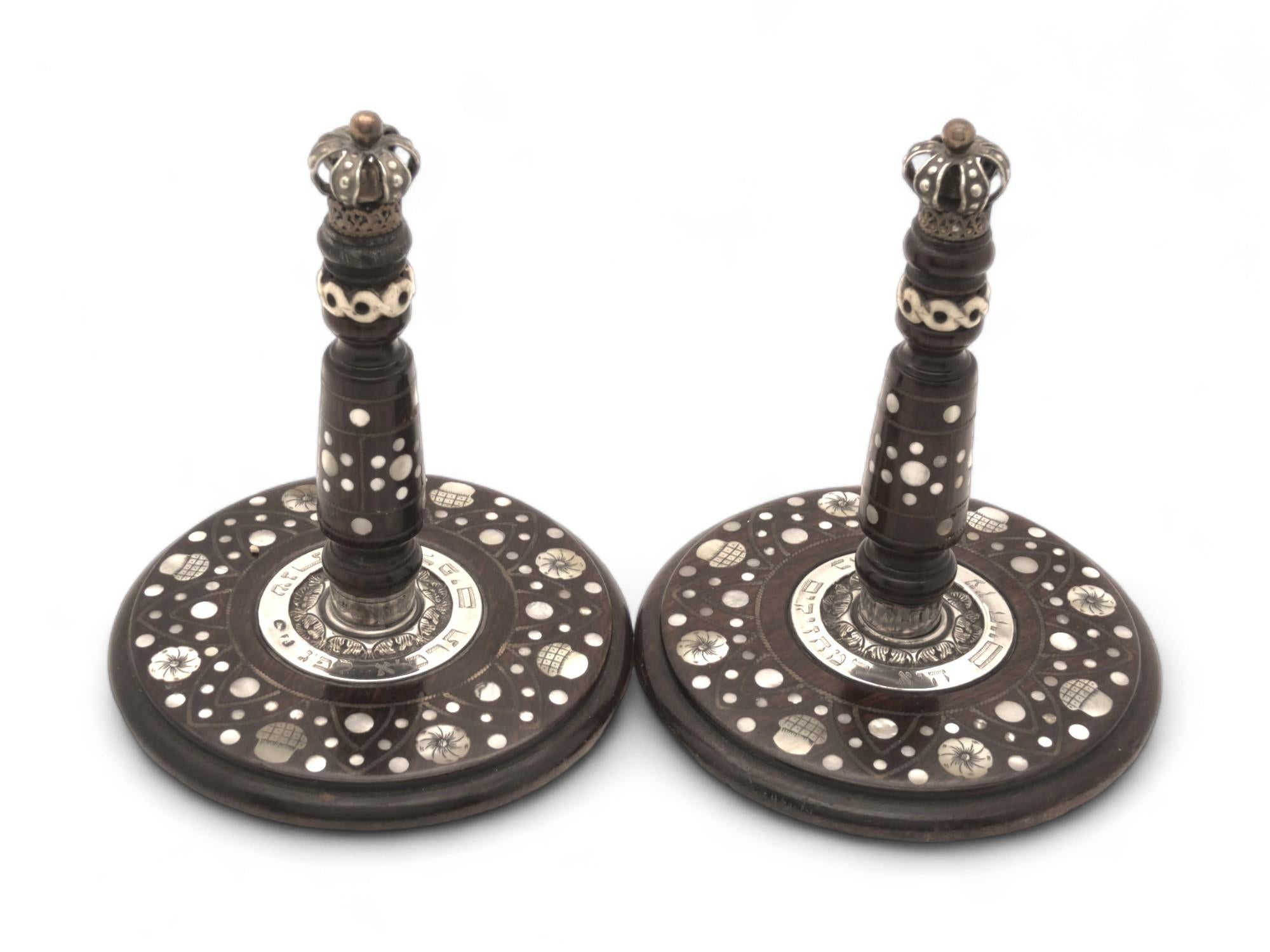 A Beautiful Pair of Carved Wood, Mother of Pearl and Silver Atzei Chaim, made in Poland in 1901.

This Lovely Pair of Atzei Chaim is one of the relics with which Torah Scrolls were adorned in Europe at the turn of the twentieth century.

Made with