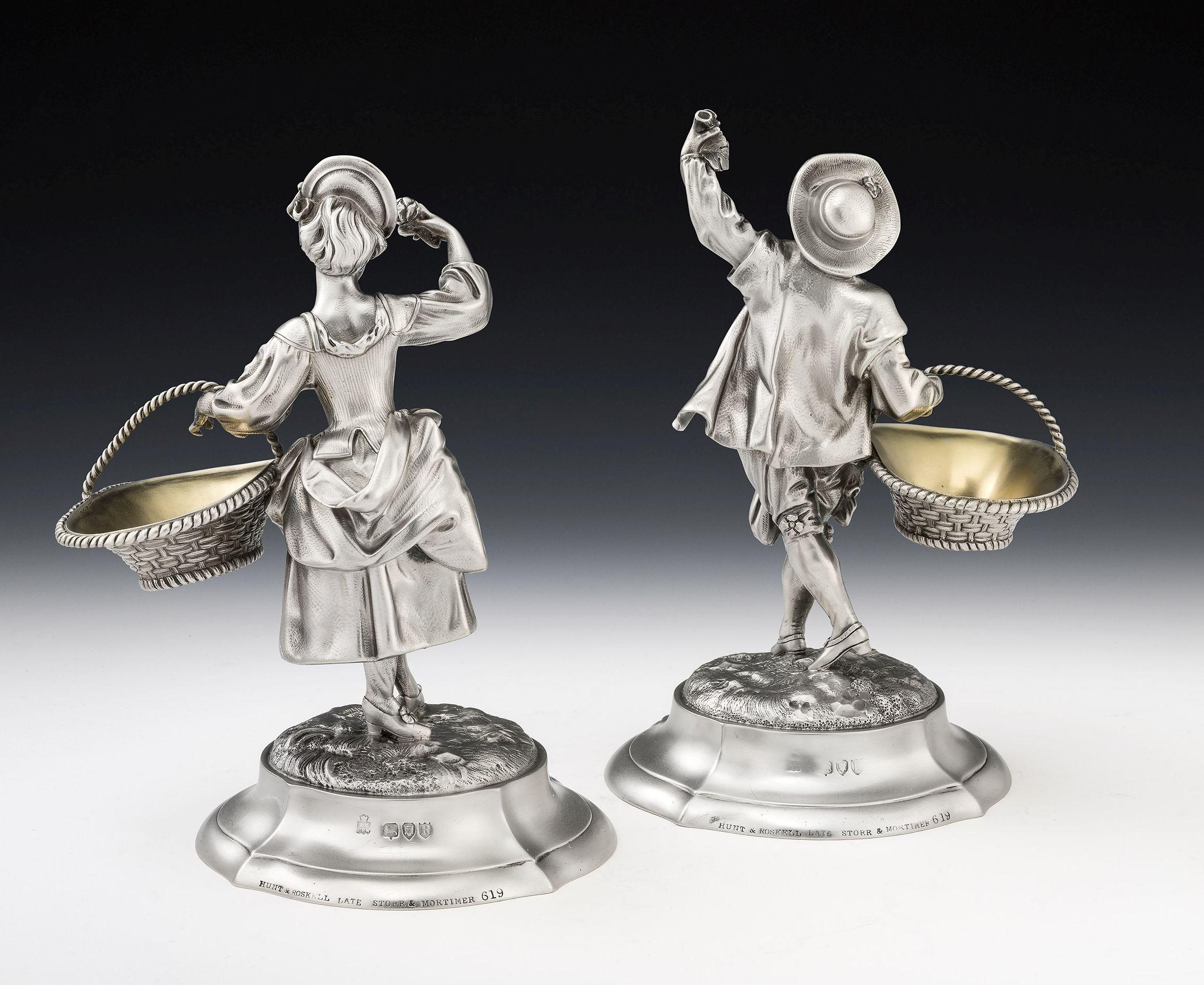 These important figural cast Pedlar Salt Cellars were made in London in 1892 by Alfred Benson & Henry Hugh Webb and retailed Hunt & Roskell. As you will see from the images the Salt Cellars are modelled as a male and female pedlar in period Georgian