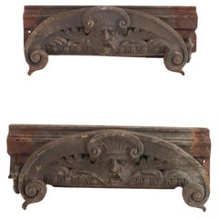 A pair of cast iron capitals with faces C 1890.