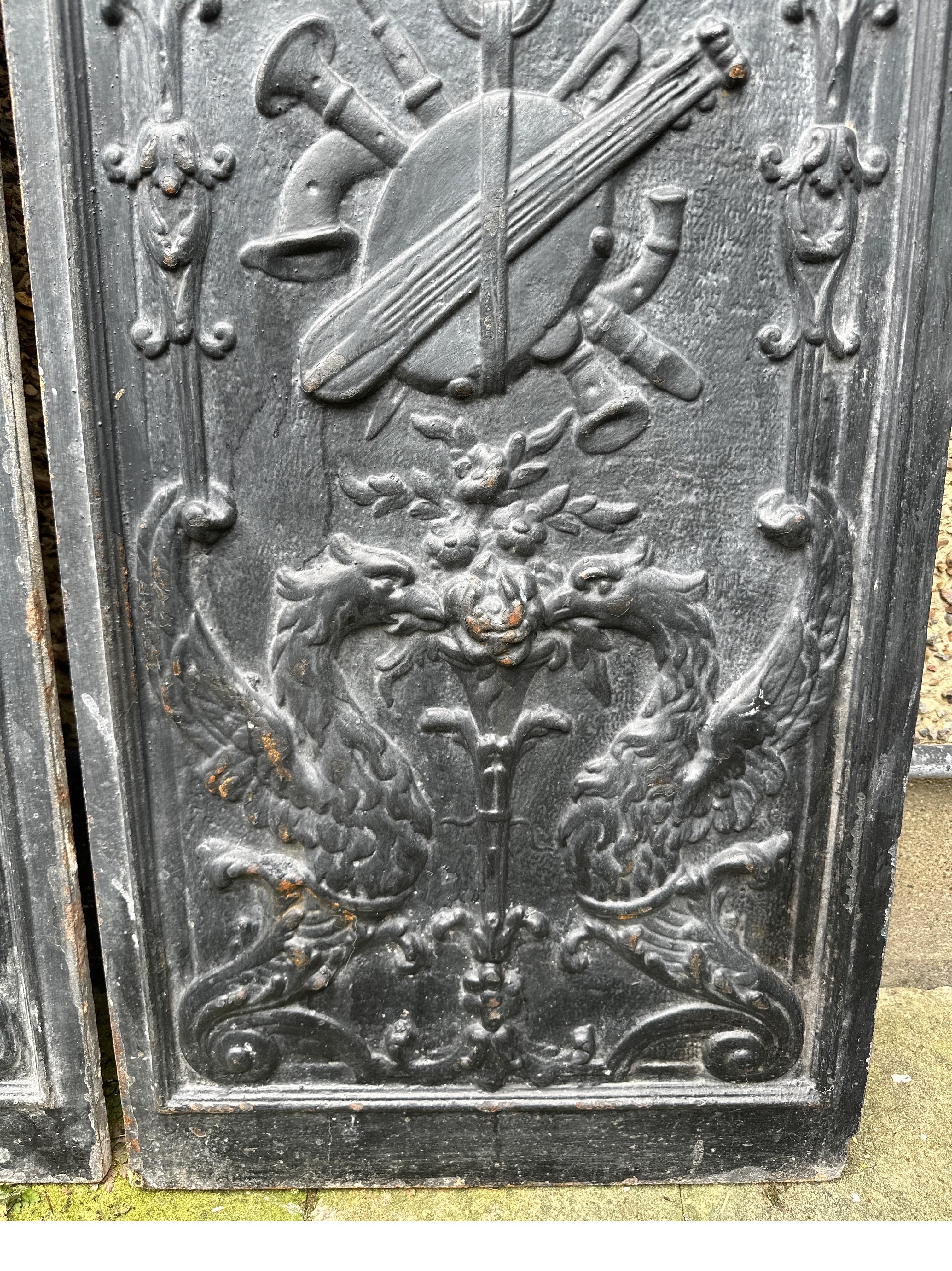 Iron A pair of cast iron panels For Sale