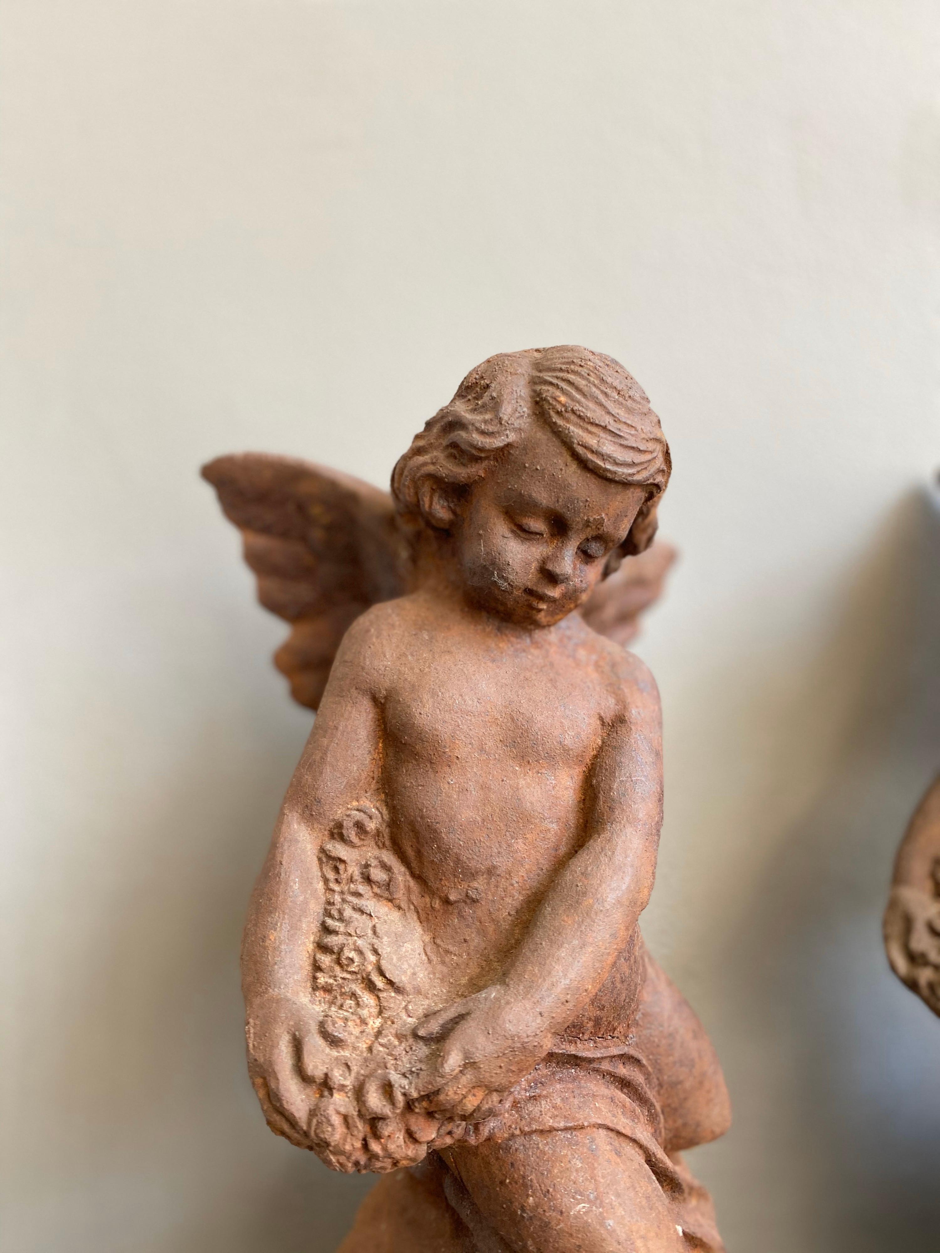 20th Century Pair of Cast Iron Putti Figures For Sale