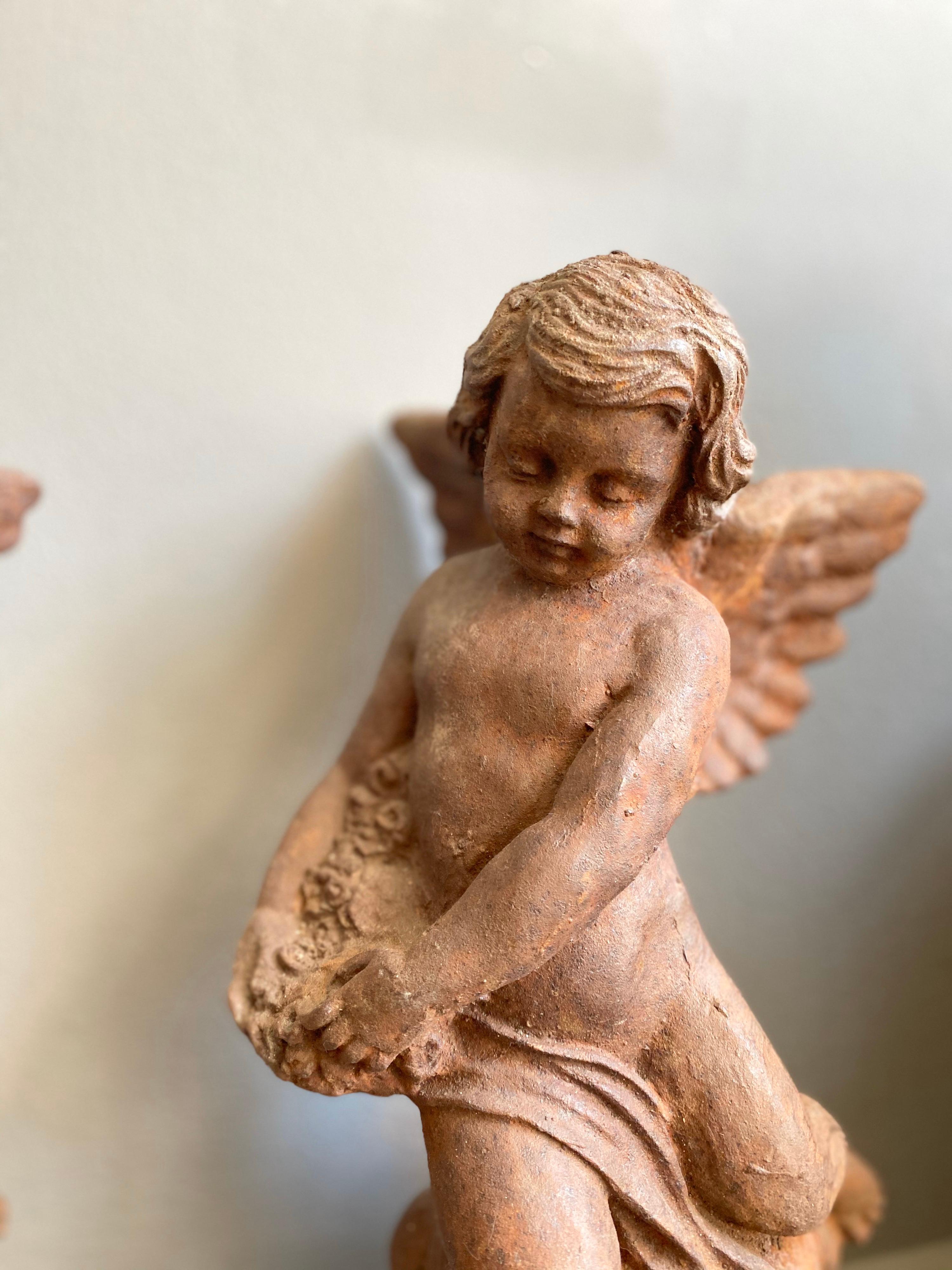 Pair of Cast Iron Putti Figures For Sale 1