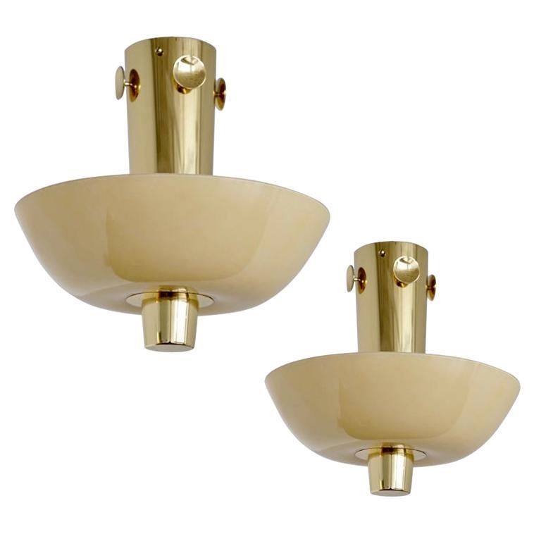 A pair of ceiling lamps by Paavo Tynell Model 9052