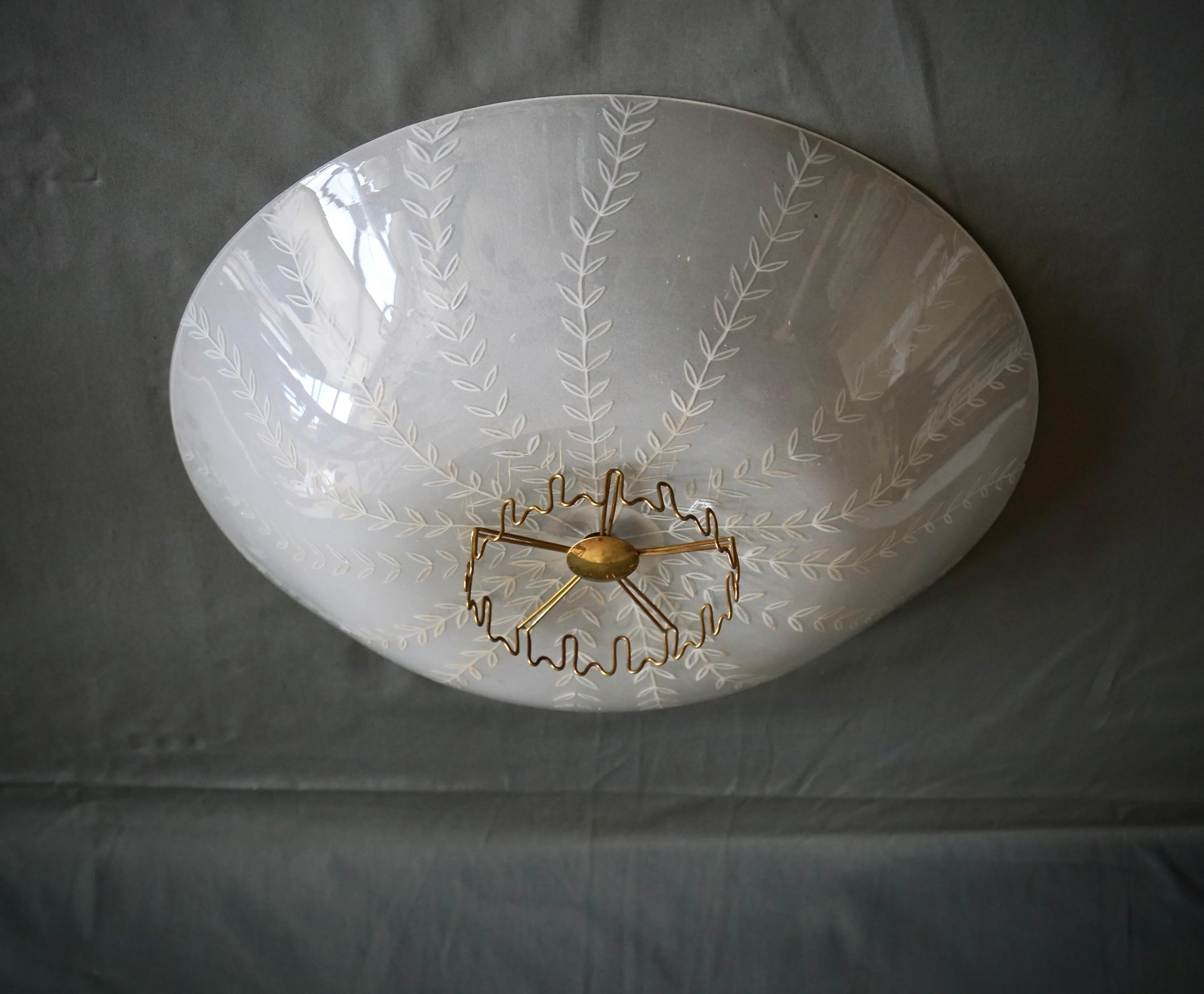 A pair of flush mount ceiling light designed by Lisa Johansson-Pape for Orno, Model 1073. Finland , Circa 1950th. Etched opaline glass with brass decor. Stamped 