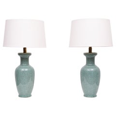 A pair of celadon crackle glazed porcelain vases mounted as table lamps.