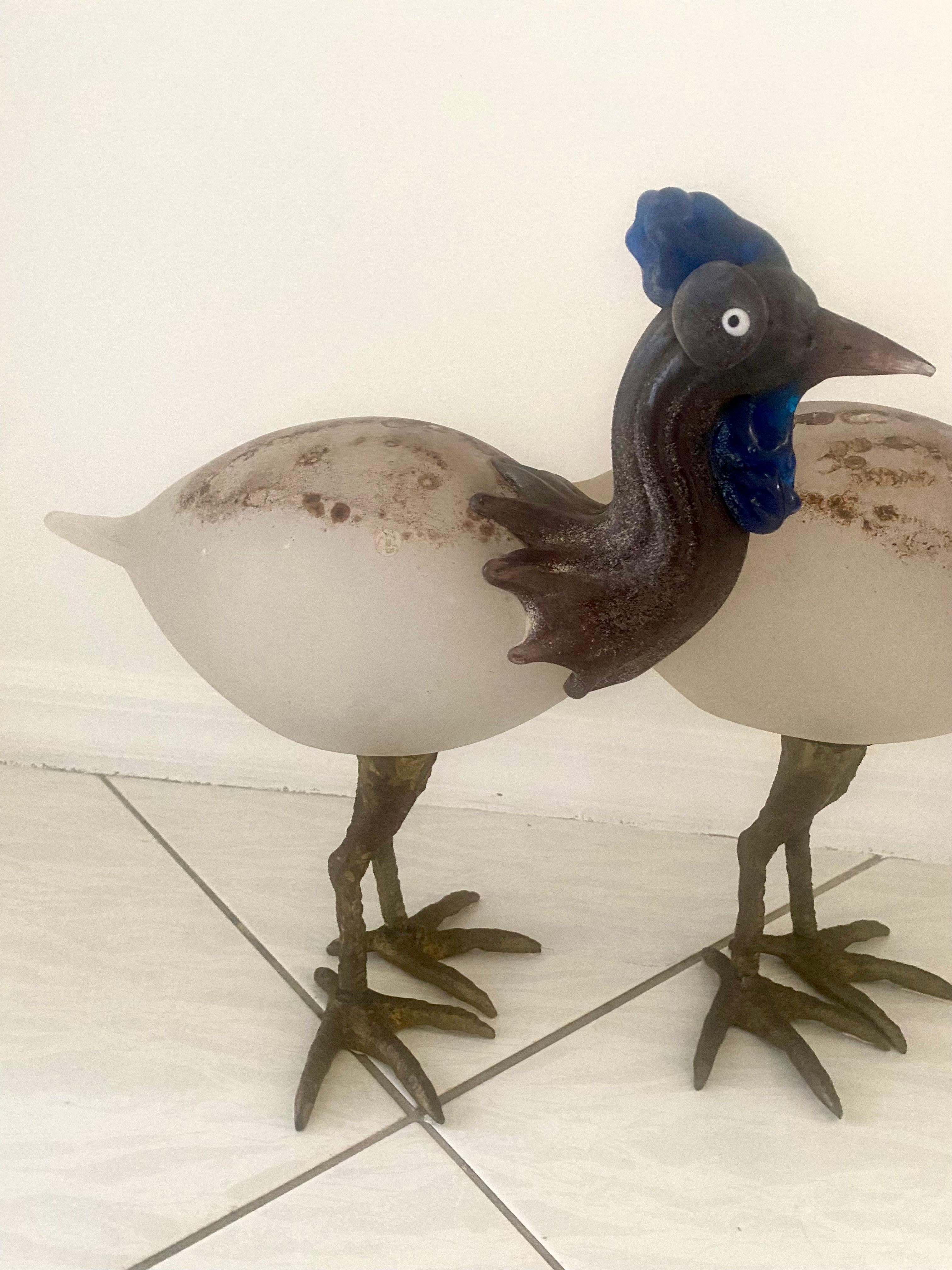 A rare pair of guinea hens in glass with the scavo technique. This technique was created by Alfredo Barbini and Cenedese in Italy, 1950s. The technique is a mixture of several powders dispersed on the glass service and then heated to 800 degrees