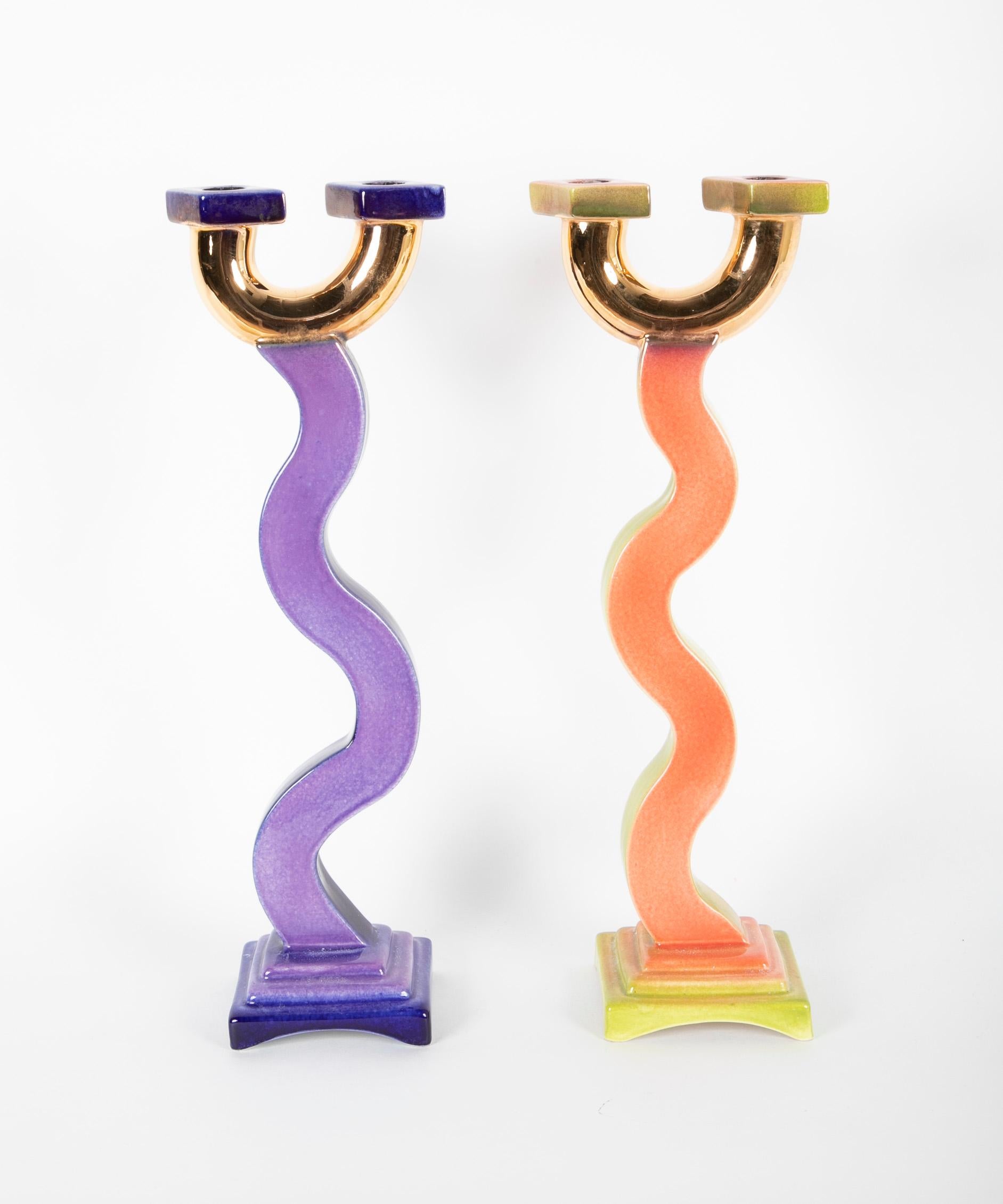 A pair of tall polychrome candlesticks designed by Jesper Packness. Signed to undersides J. Packness.
